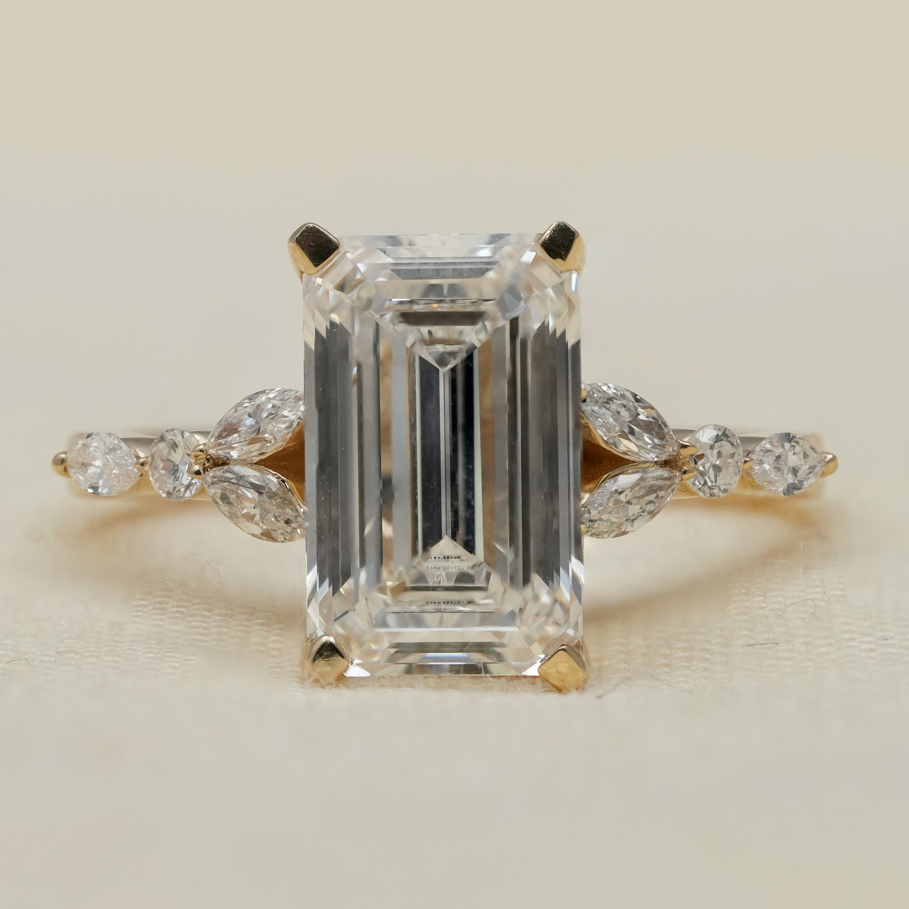 Emerald cut lab grown diamond ring with accent stones for anniversary