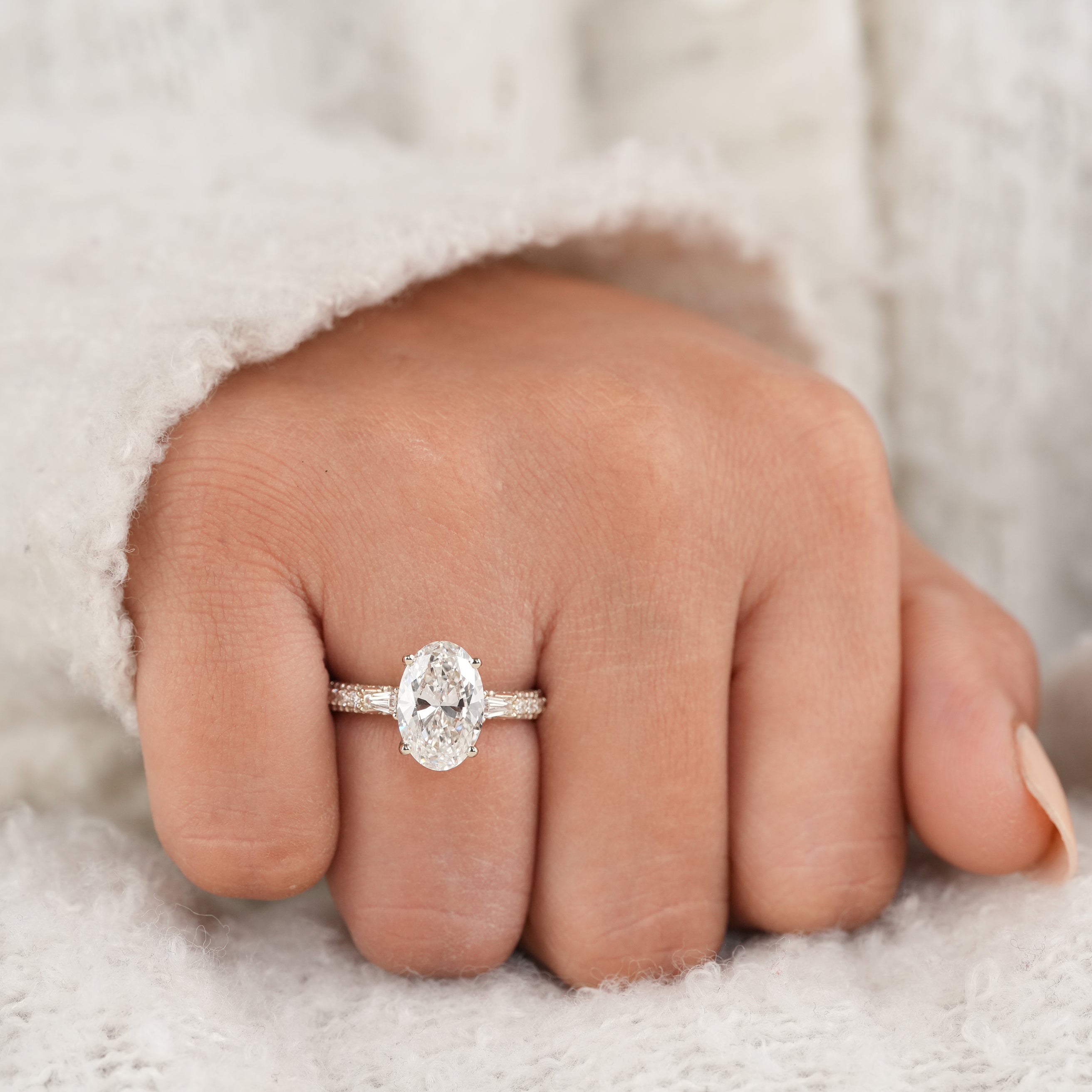 Modern Oval Cut Engagement Ring with Tapered Baguette Side Diamonds