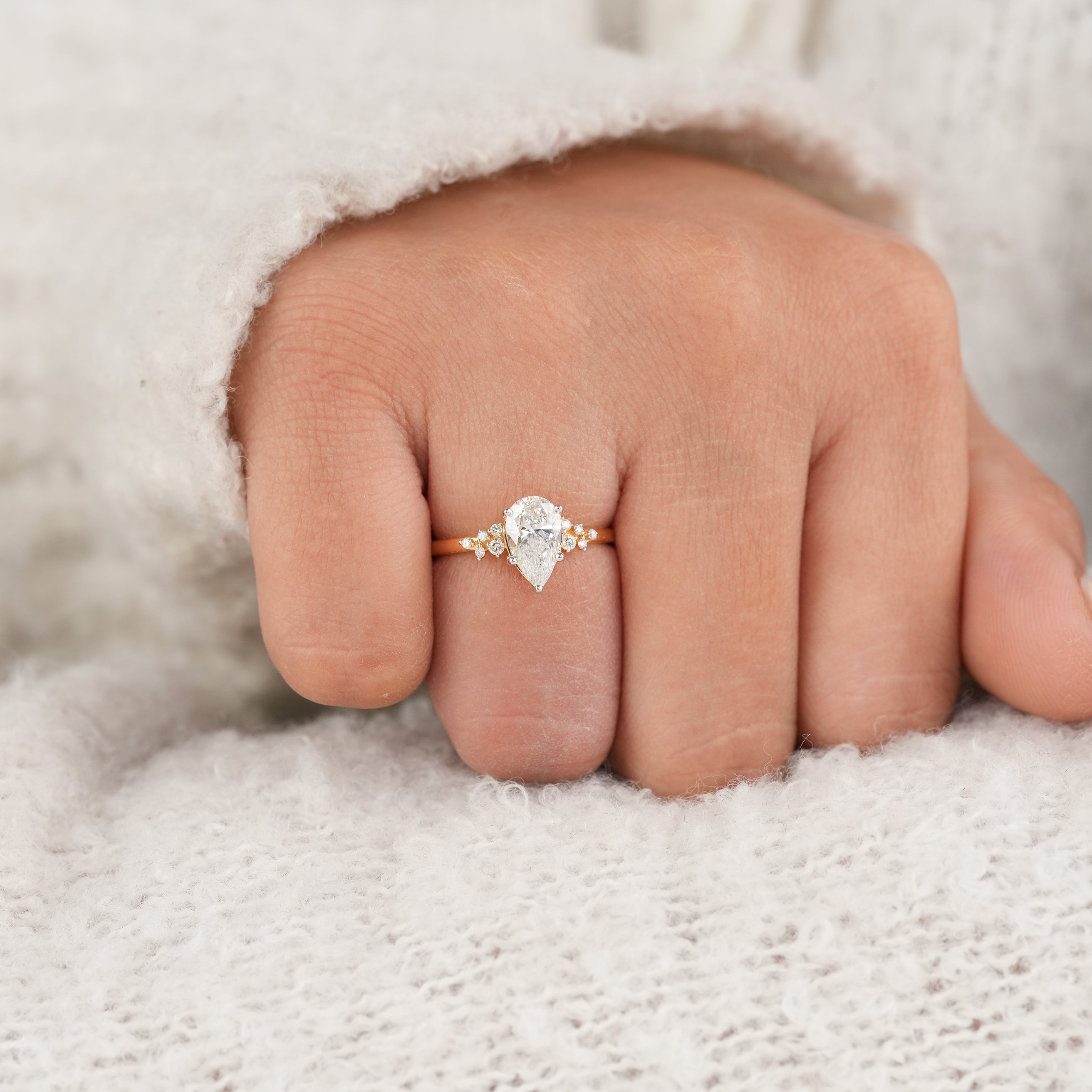 Minimal Yellow Gold Pear Diamond Ring with Sparkling Cluster Setting