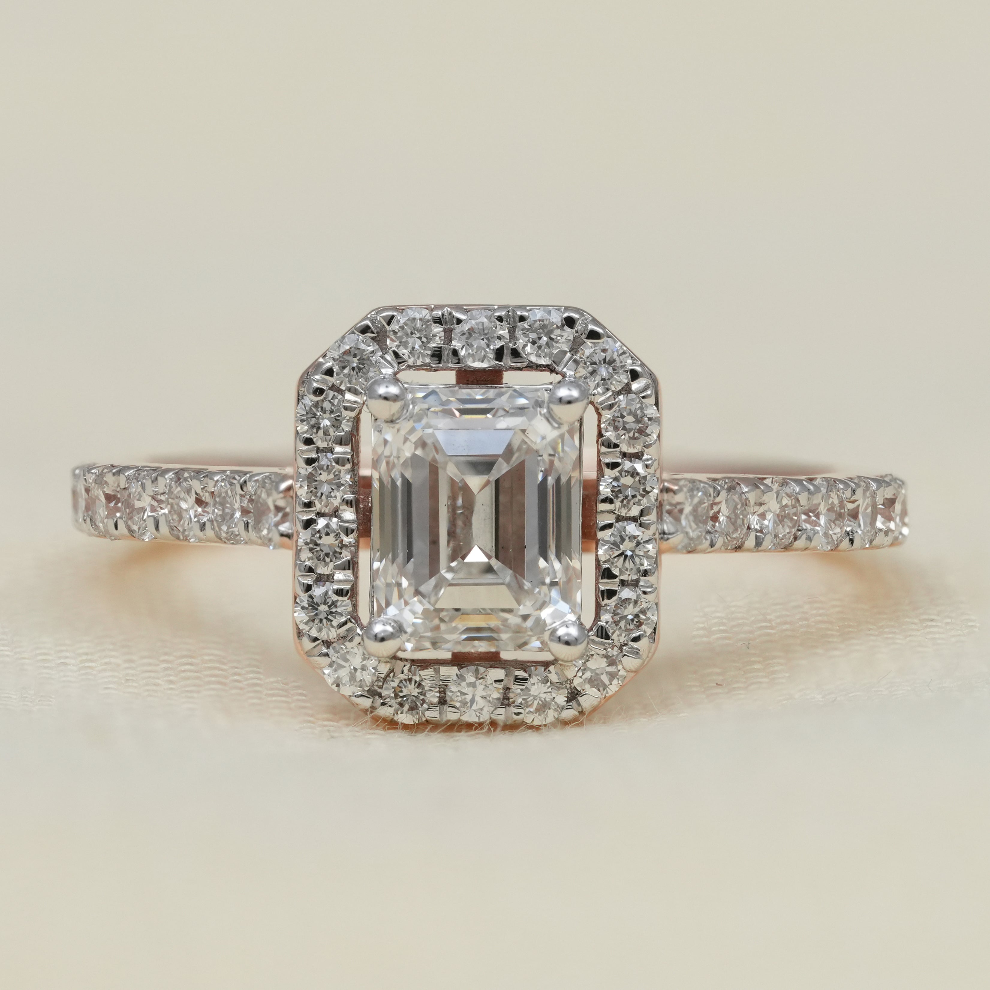 Emerald cut halo ring featuring a lab grown diamond for elegant engagements