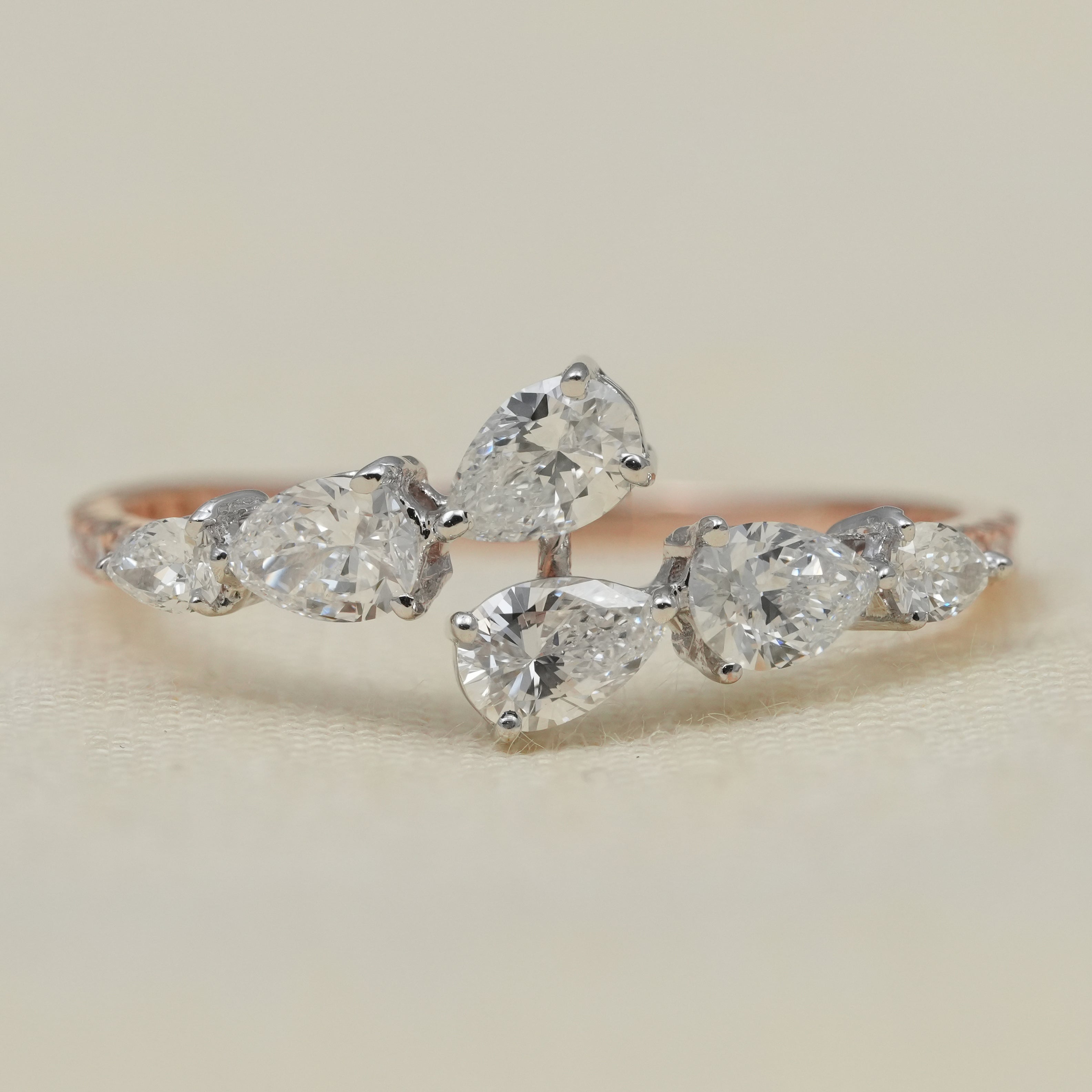 Pear cluster band ring featuring lab grown diamonds in elegant arrangement
