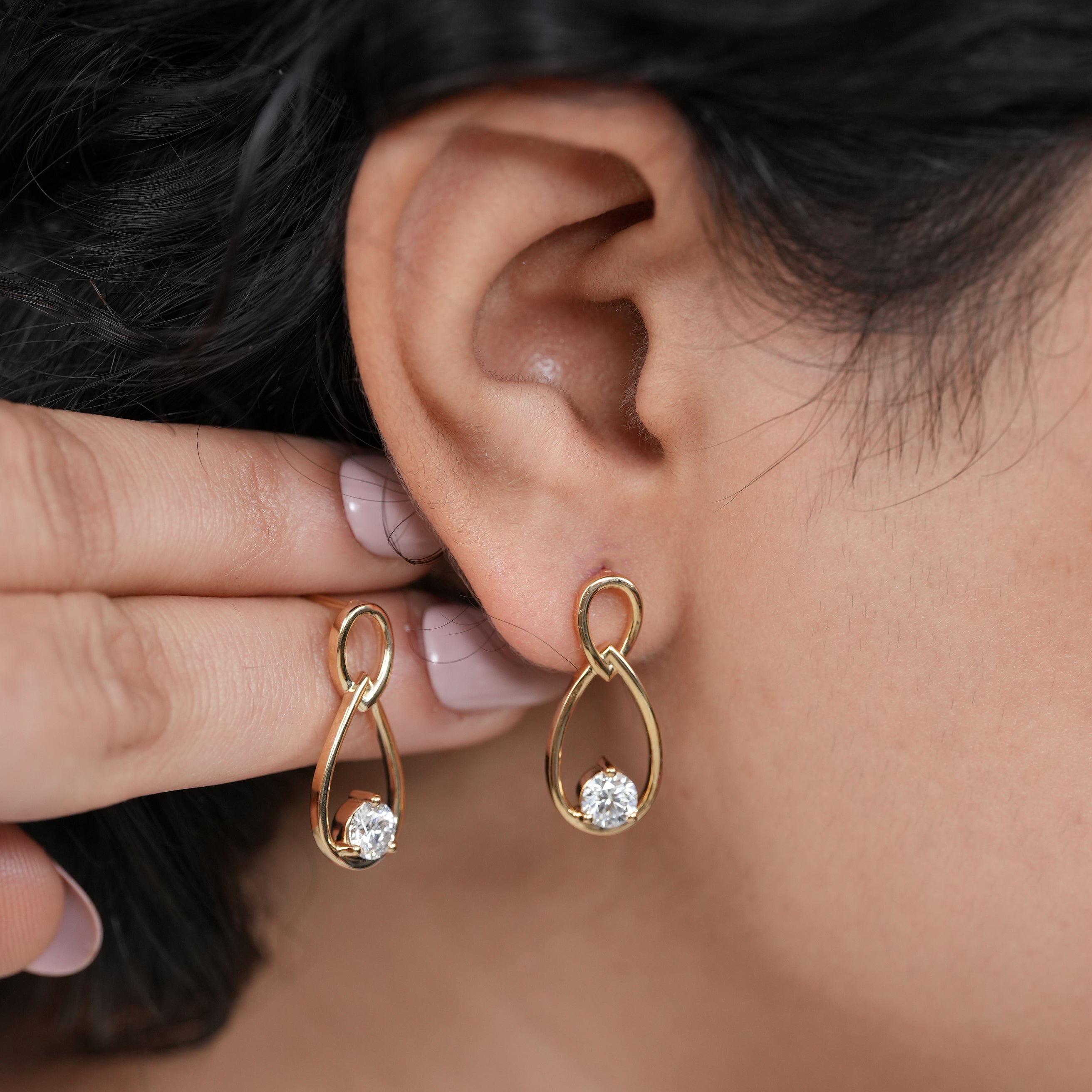 Luxury gold dangle earrings with round diamond sparkle
