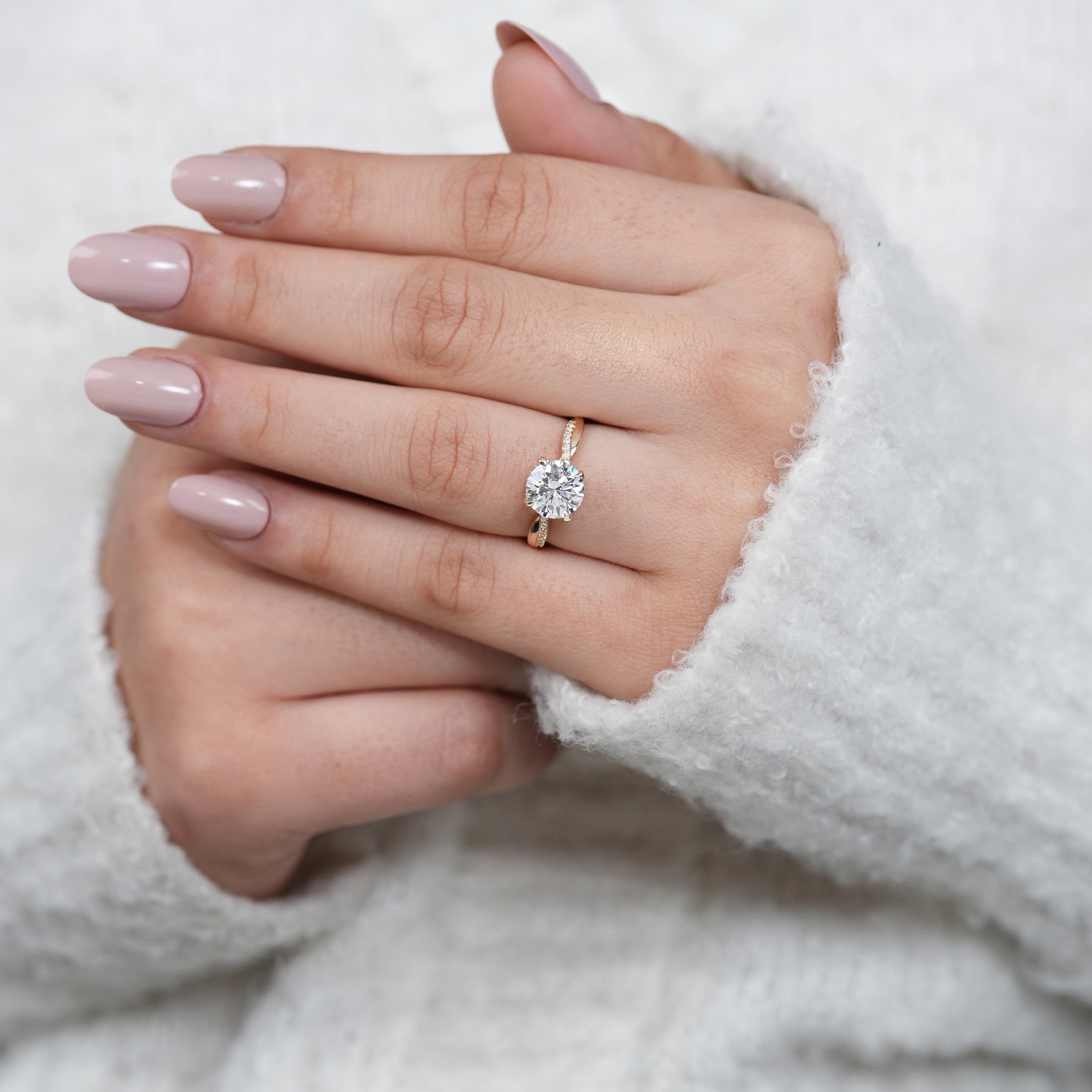 Yellow gold twisted engagement ring with round lab grown diamond
