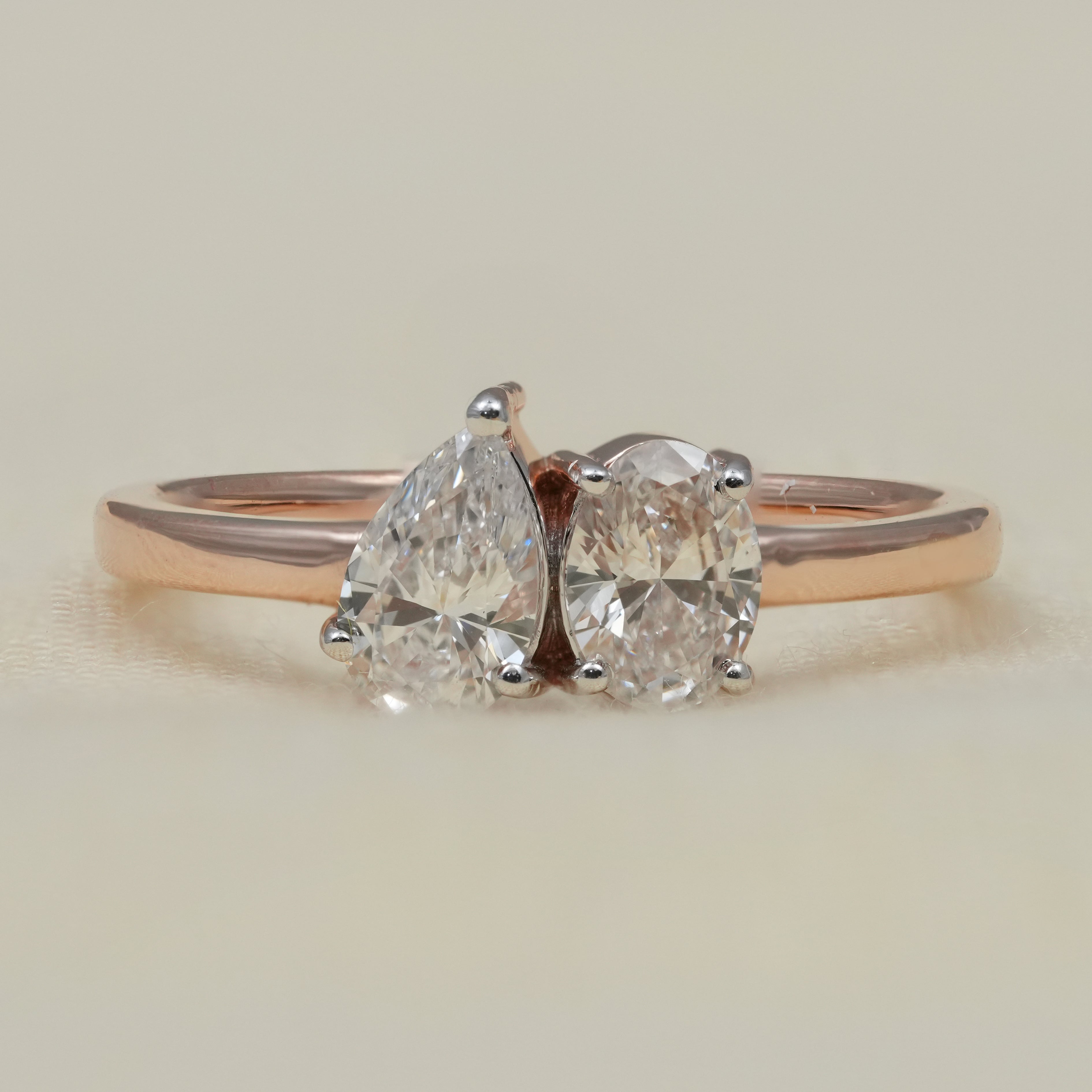 Toi et moi ring featuring pear and oval lab grown diamonds