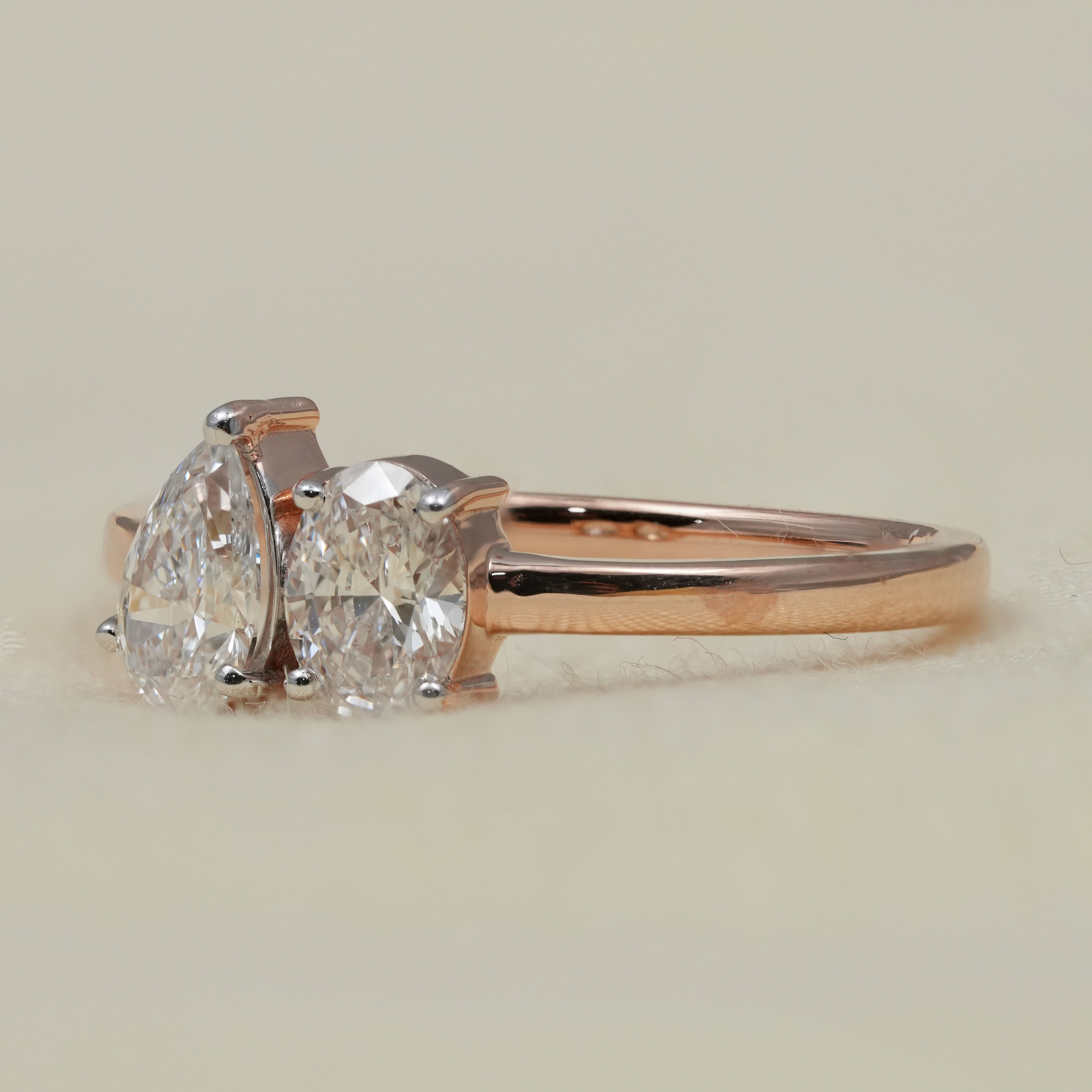 Romantic toi et moi engagement ring showcasing lab grown diamond pairing