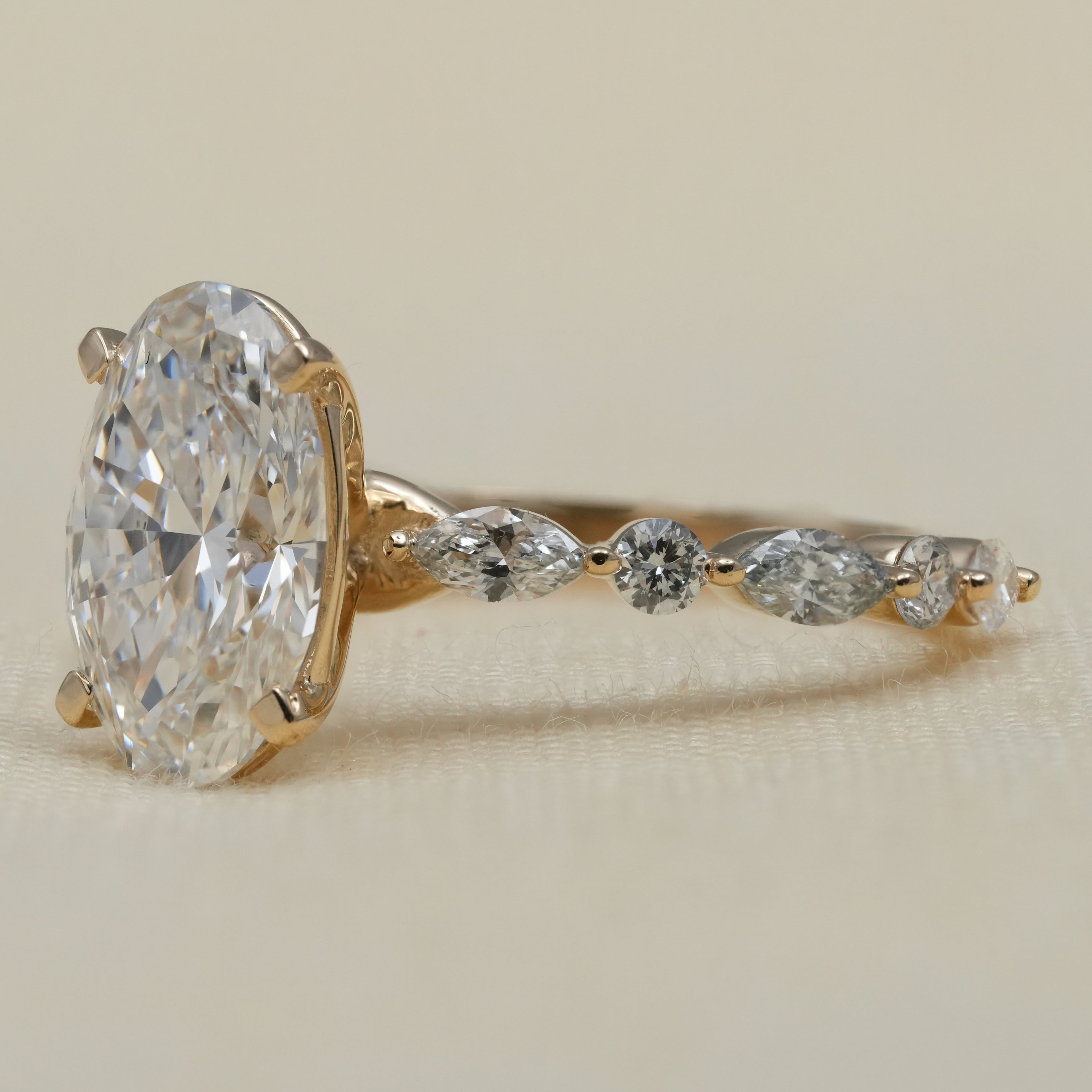 Graceful oval lab grown diamond ring, marquise side stones for wife