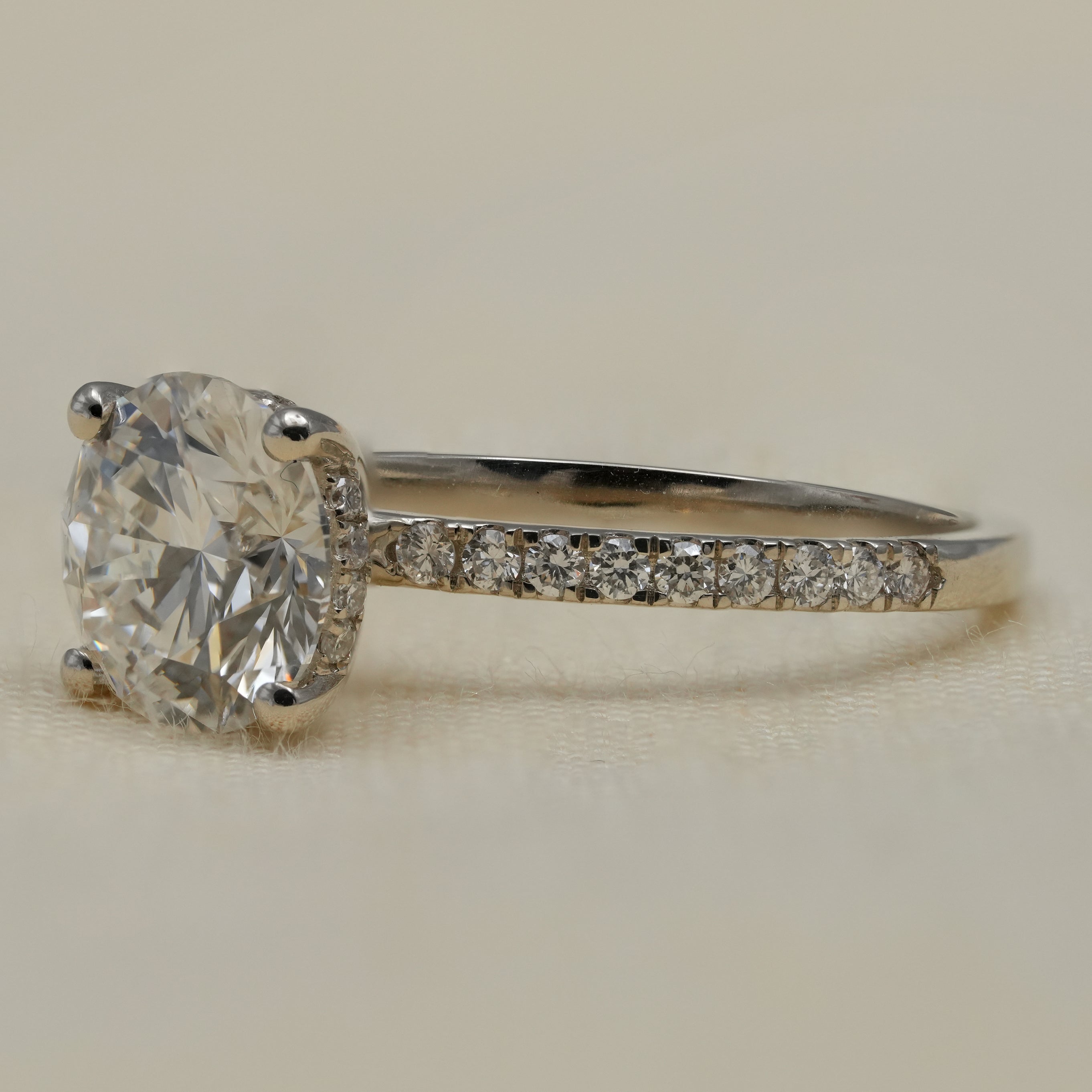 Round lab grown diamond engagement ring in sleek white gold