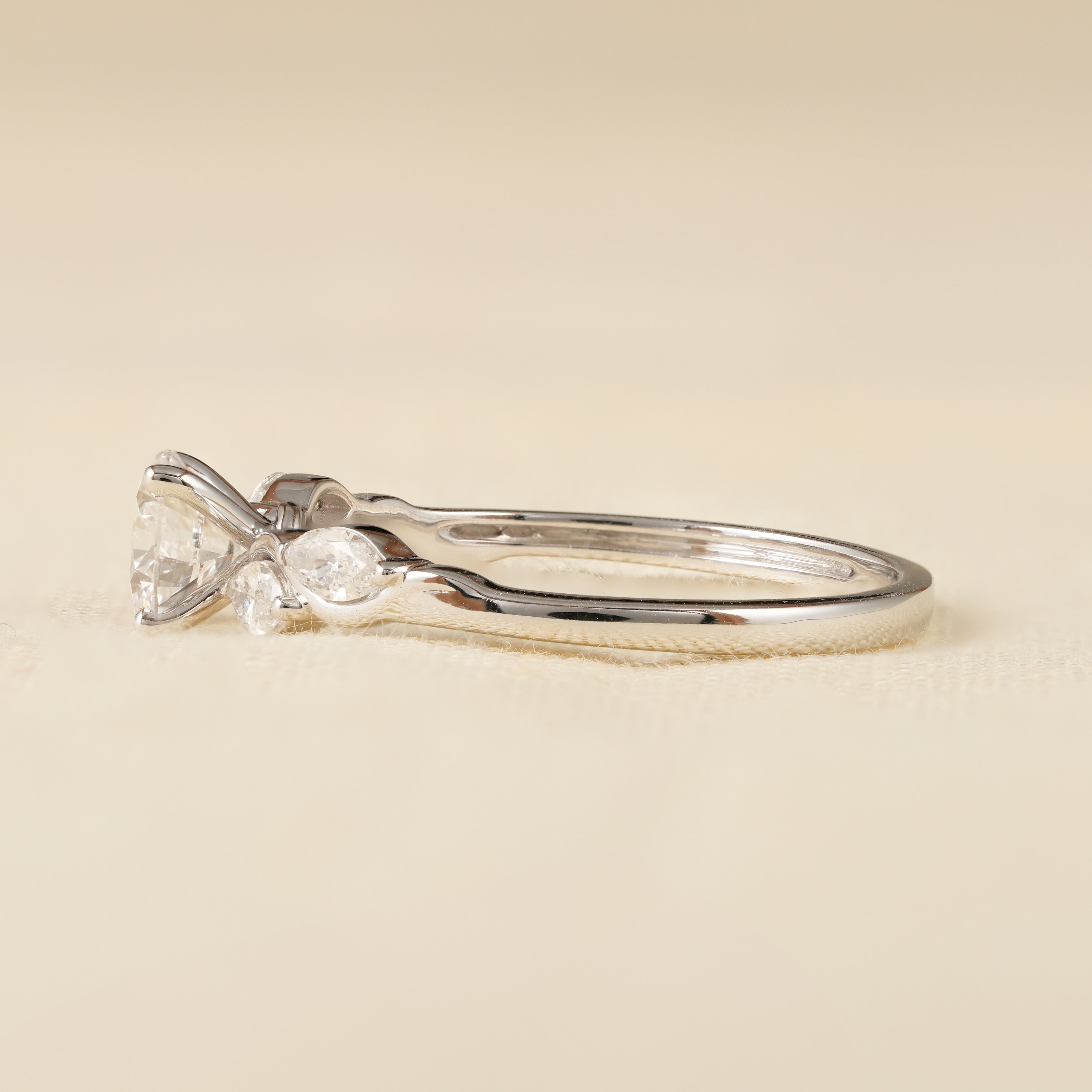Elegant Round Cut Diamond Ring with Marquise Leaf Side Stones