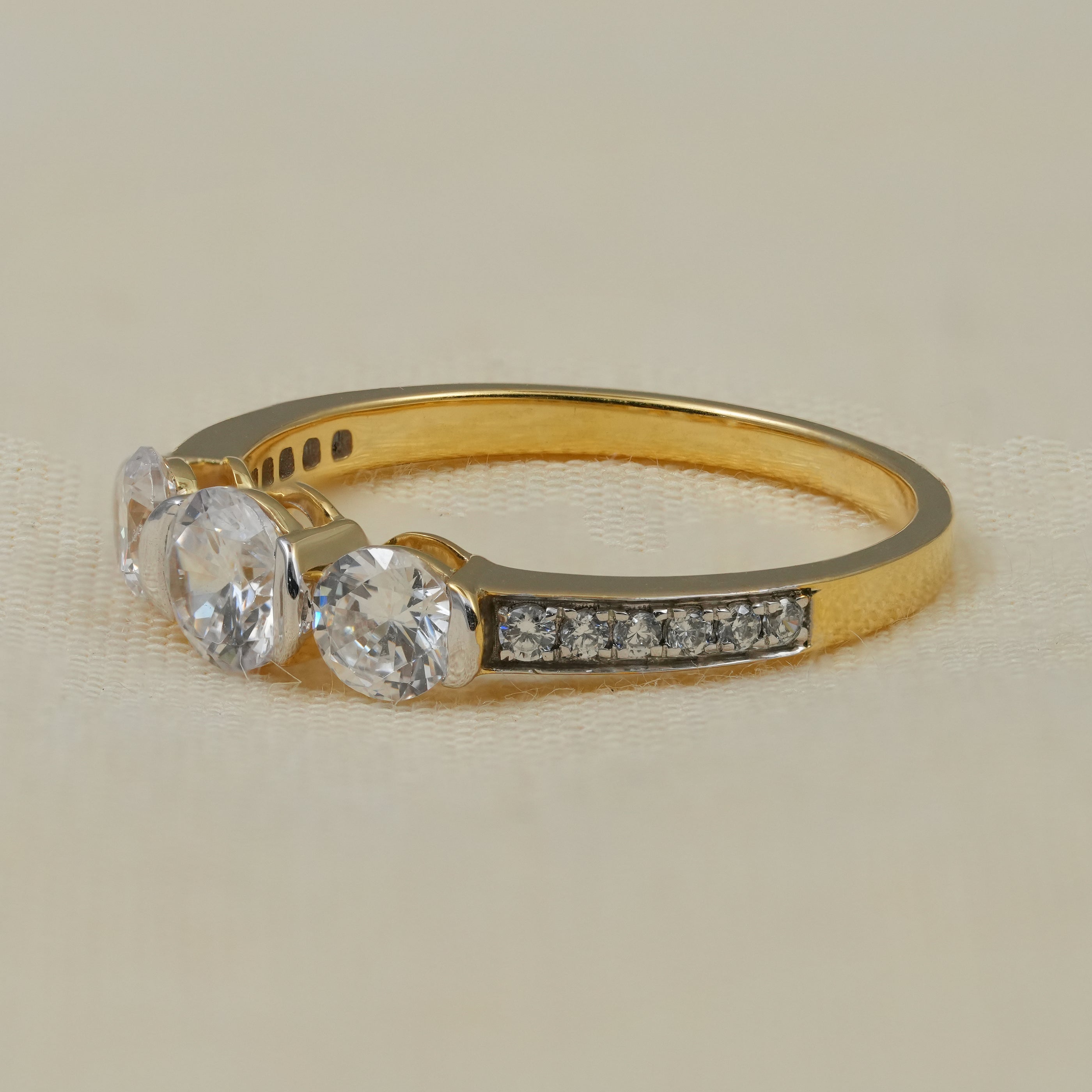 Luxury three stone lab grown diamond ring with pavé shoulders