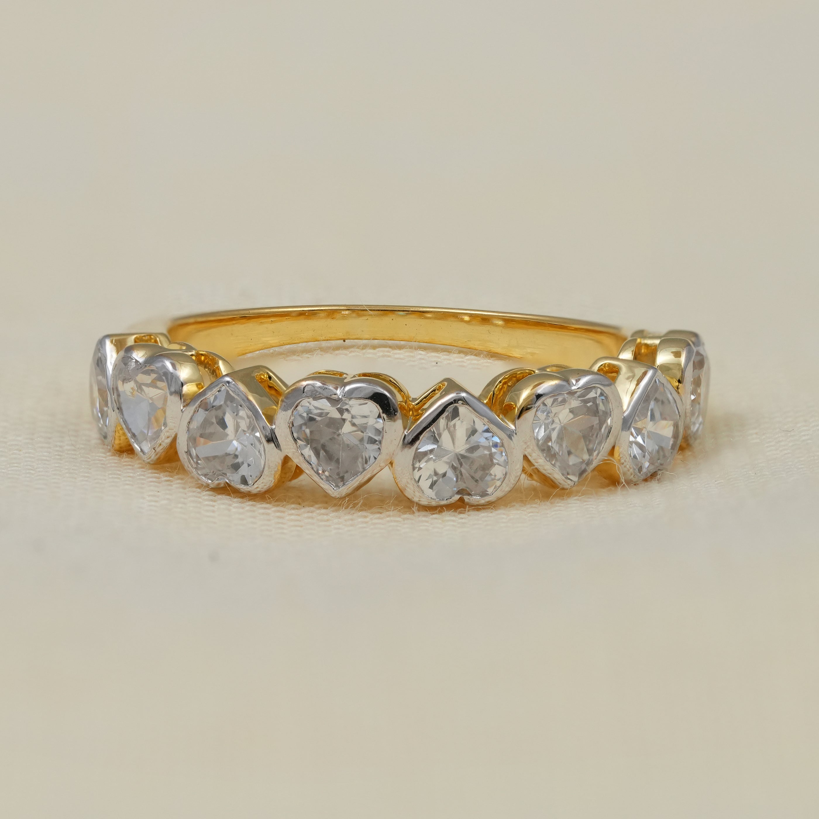 Yellow gold heart shaped lab grown diamond eternity wedding band