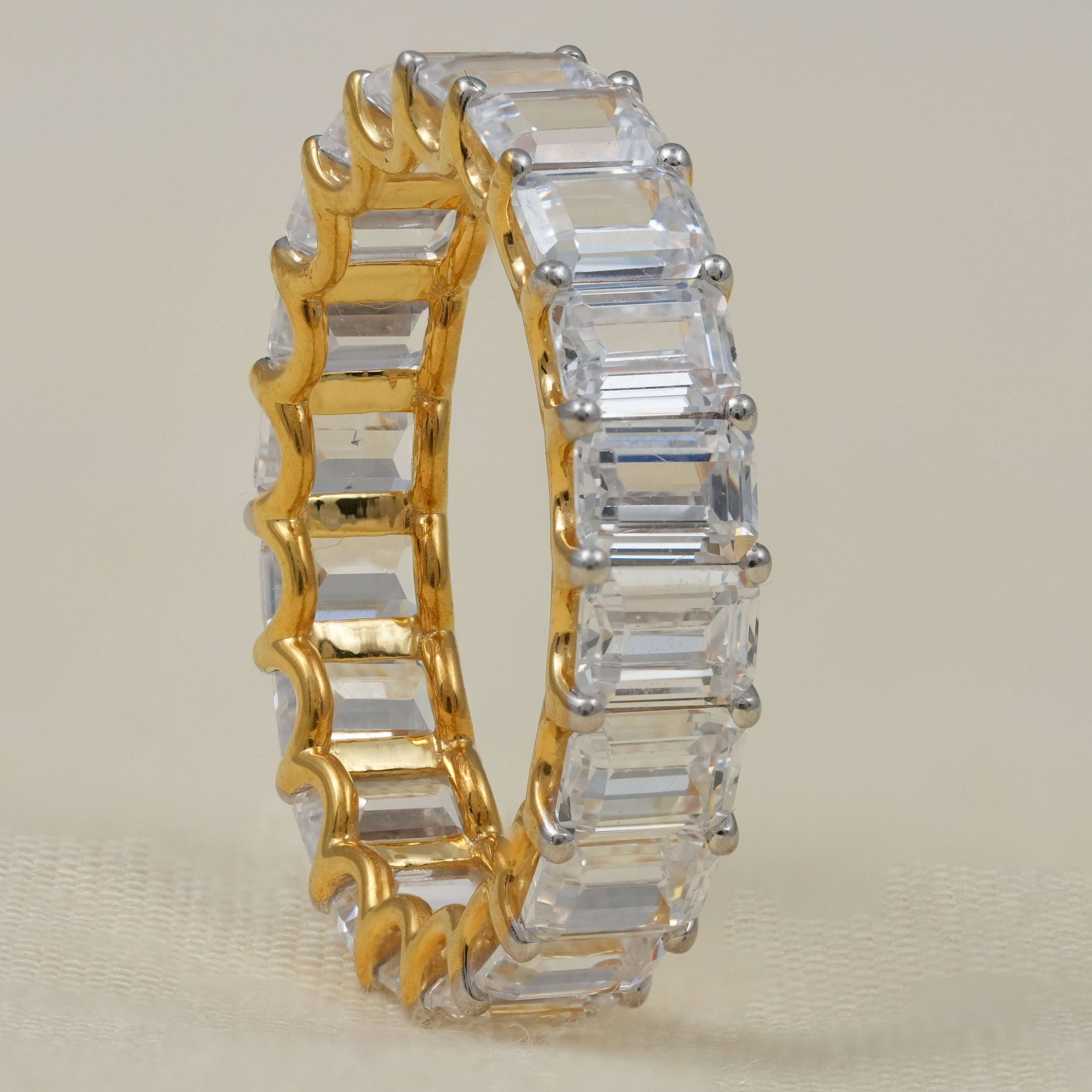 Elegant emerald cut lab grown diamond eternity band yellow gold