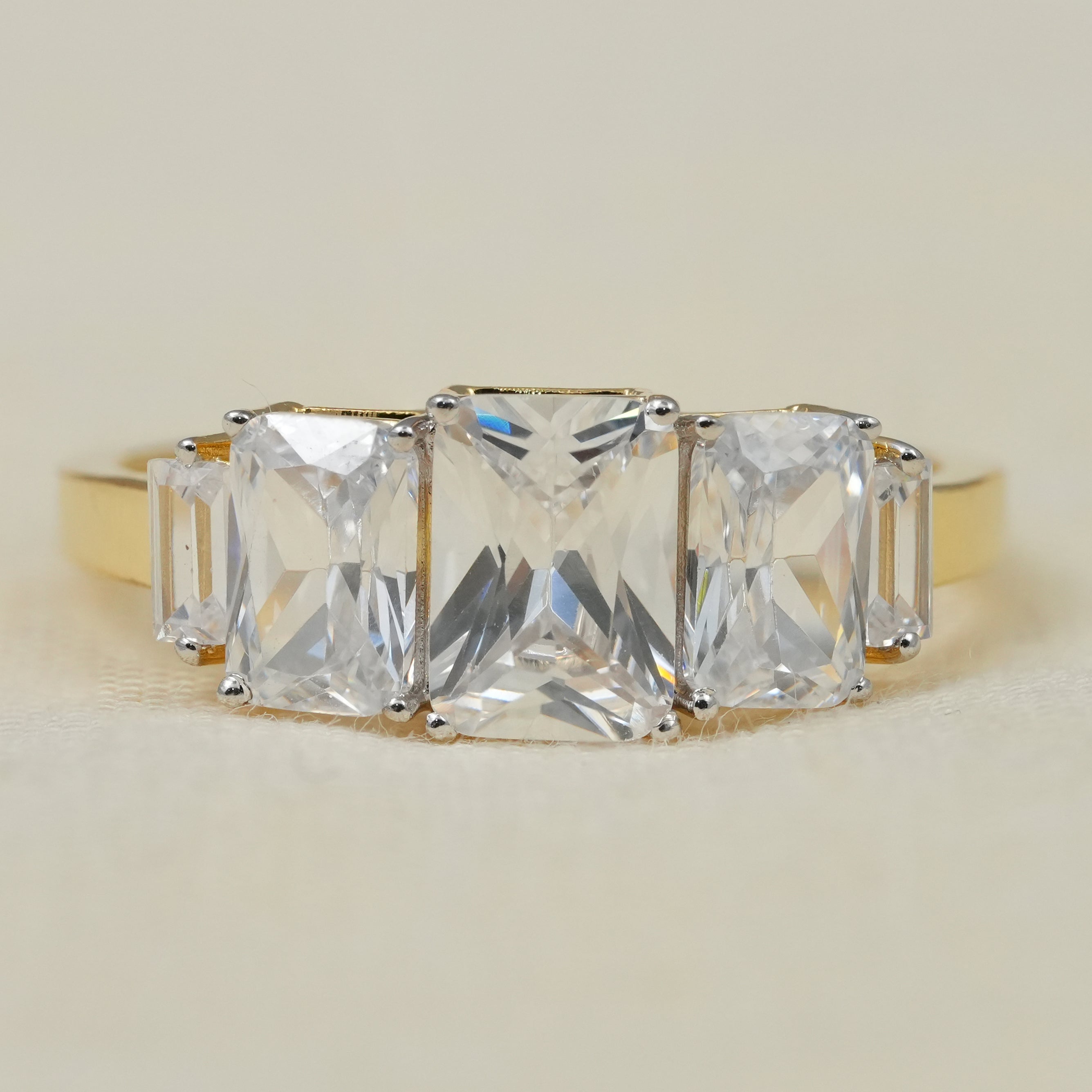 Radiant three stone engagement ring with lab grown diamonds in yellow gold