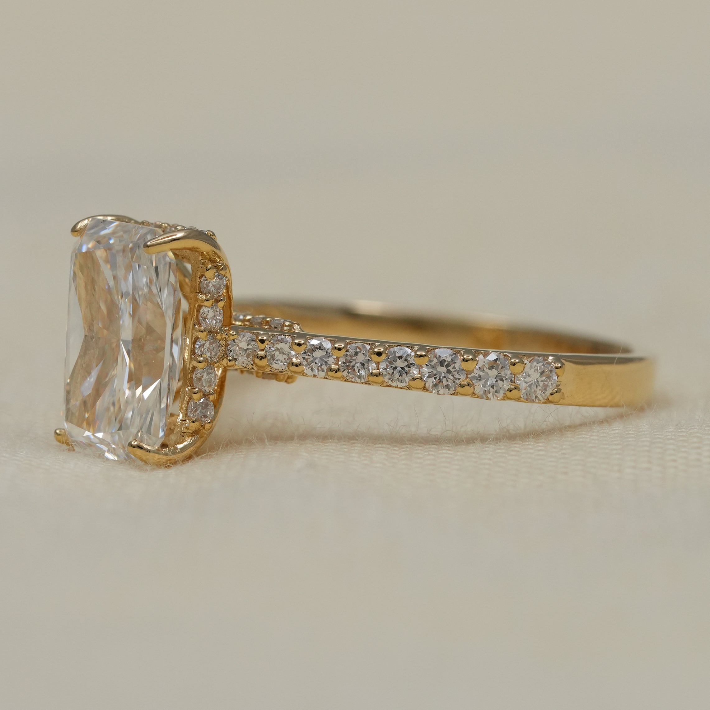 Radiant lab grown diamond ring in polished yellow gold setting