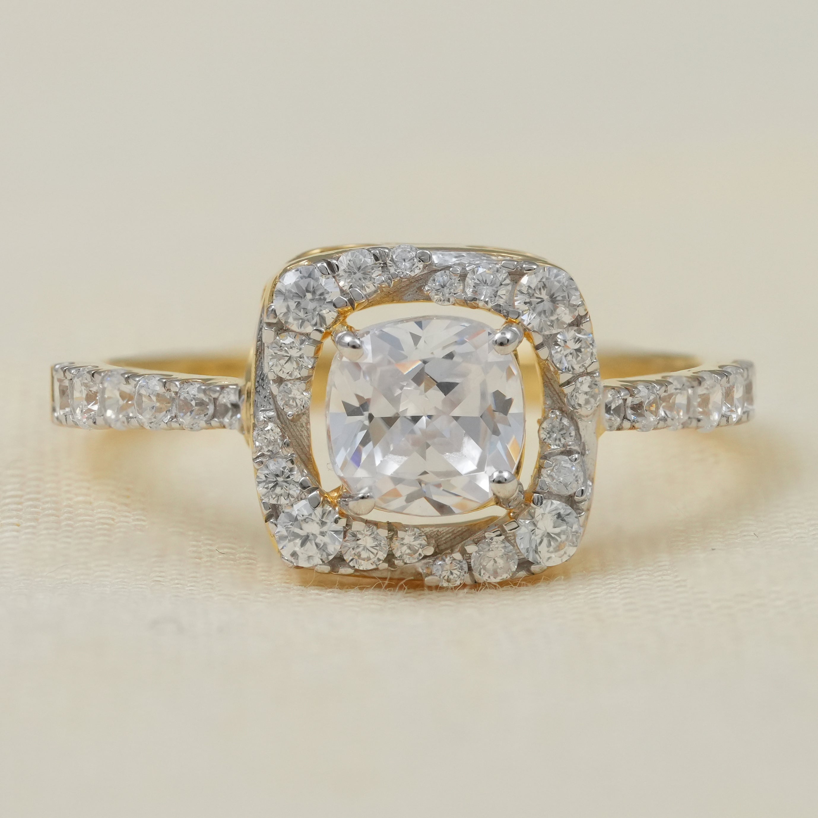 Cushion style halo ring featuring round lab grown diamond center
