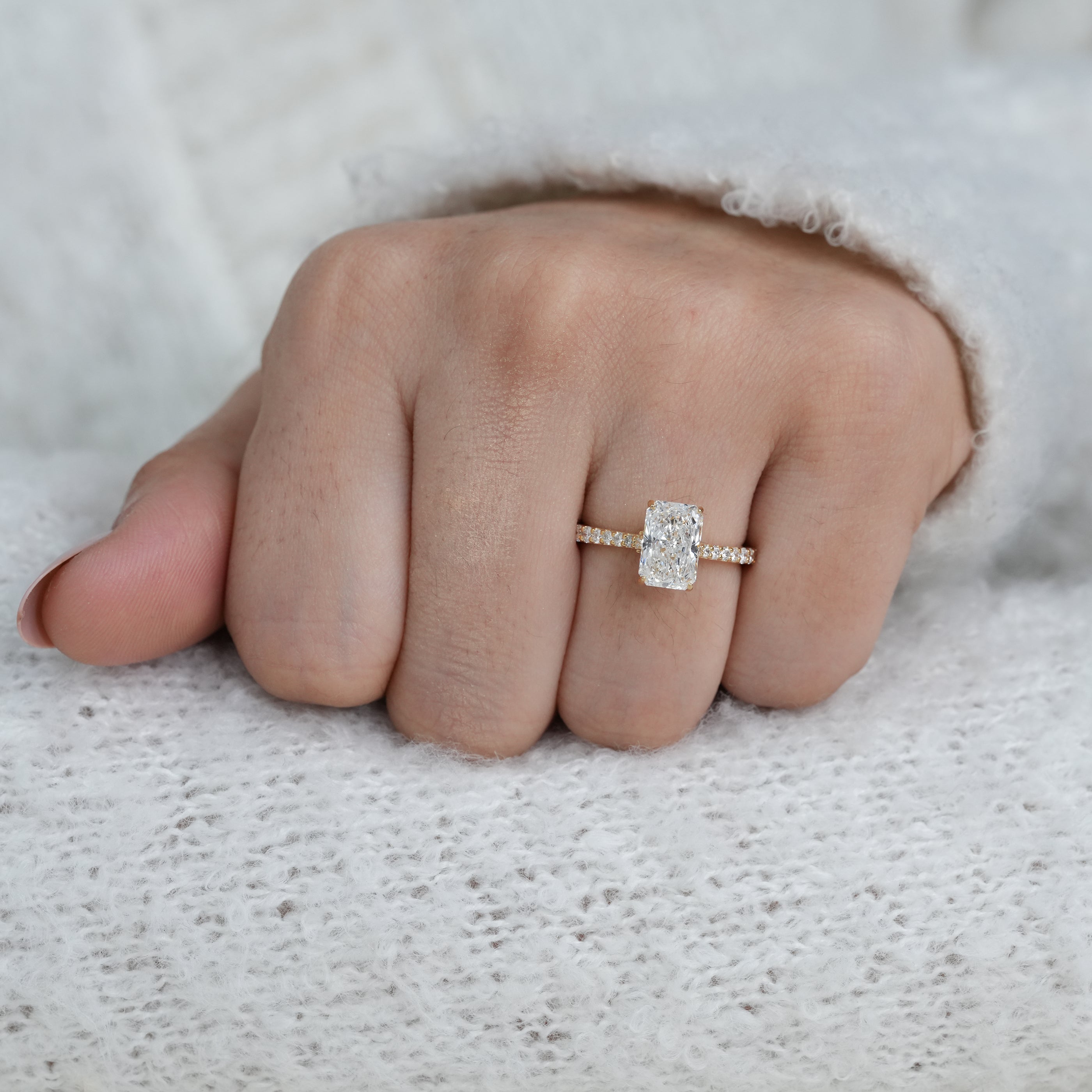 Radiant lab grown diamond solitaire with slim pavé gold band
