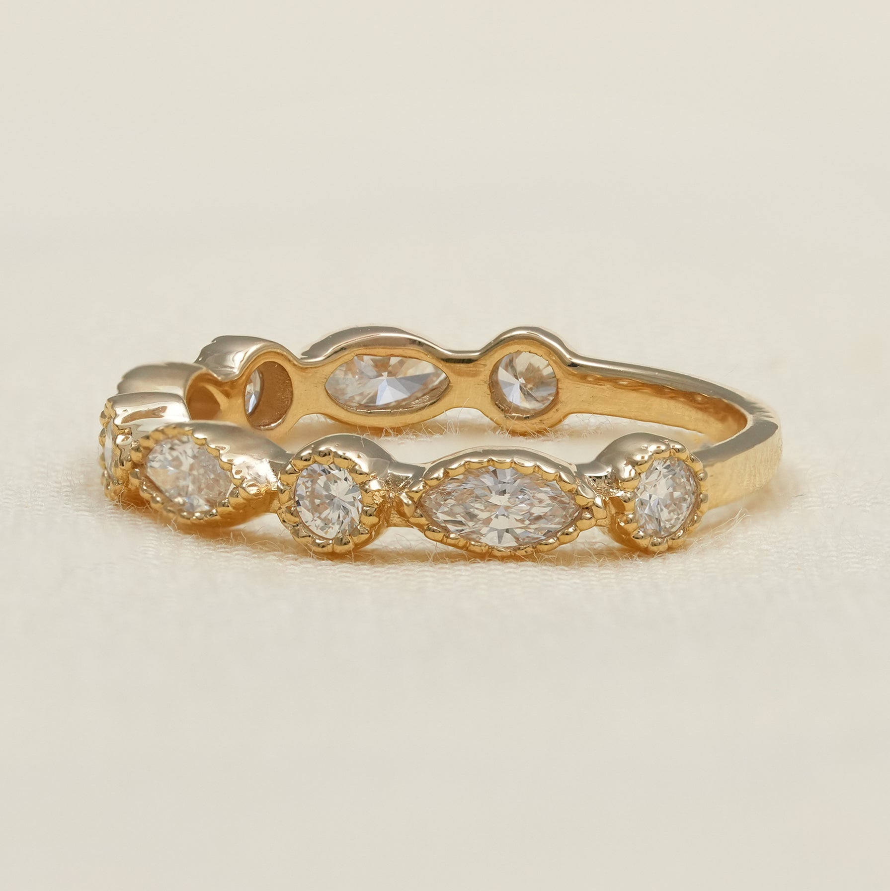 Yellow gold lab grown diamond band with marquise and round stones