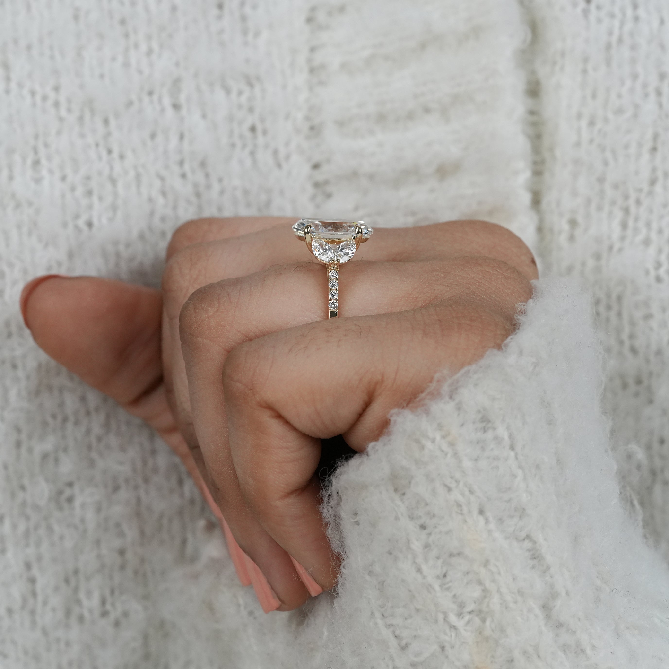 Timeless oval lab grown diamond ring with marquise accents