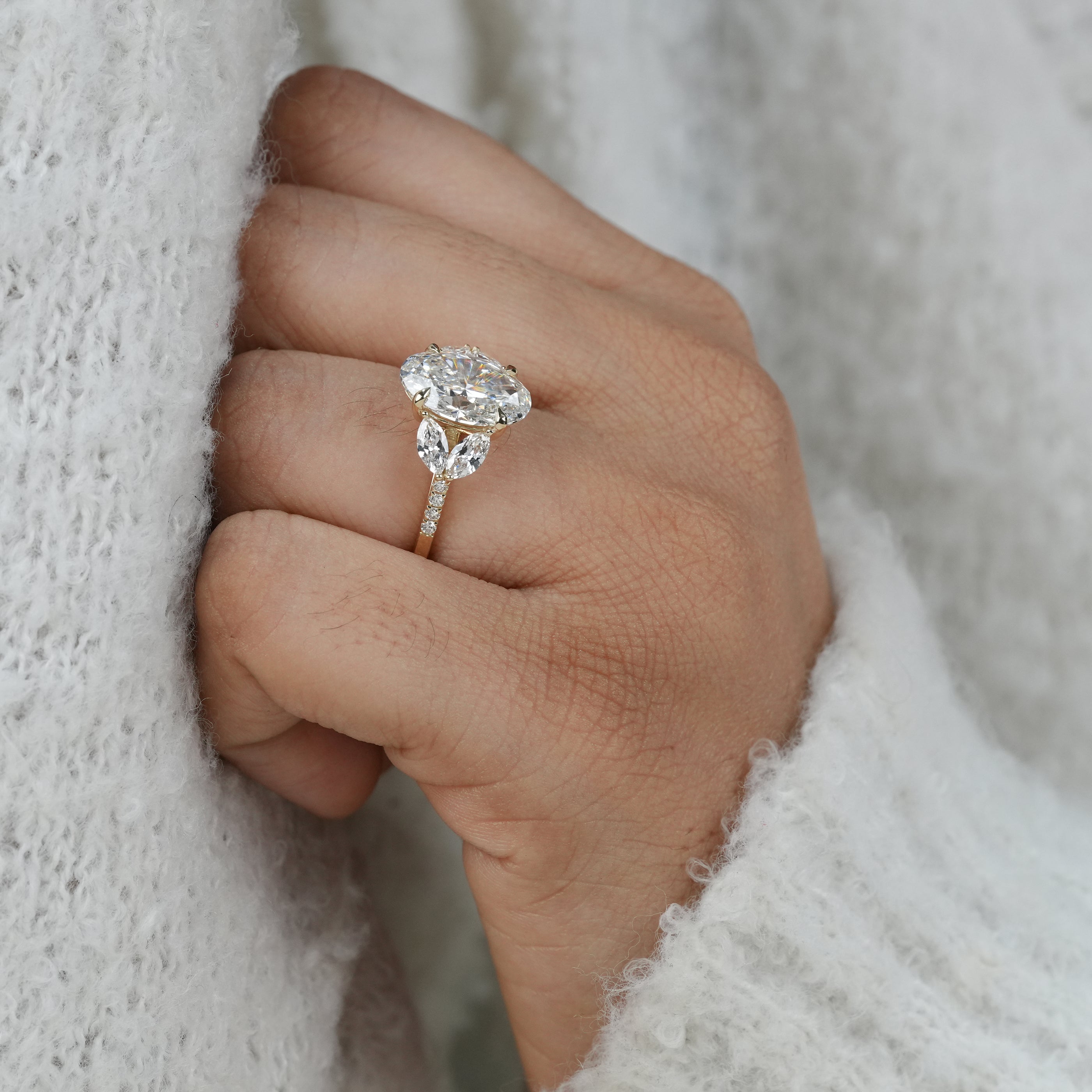 Statement oval lab grown diamond ring with sculpted side diamonds