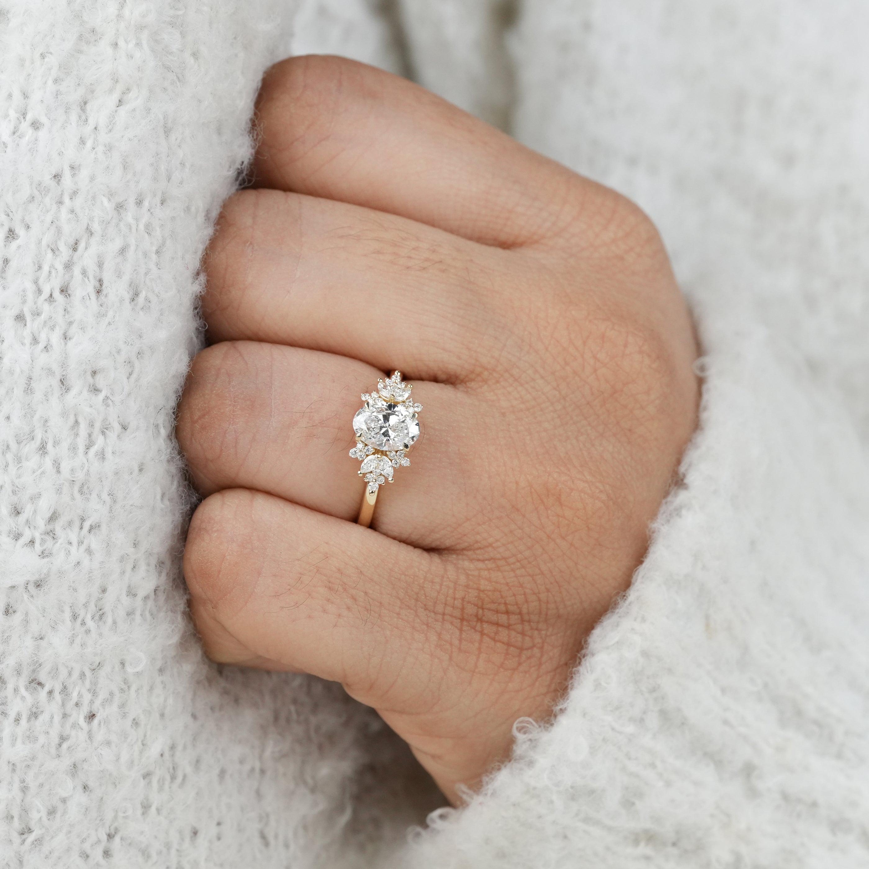 Designer oval lab grown diamond ring with sculpted side clusters