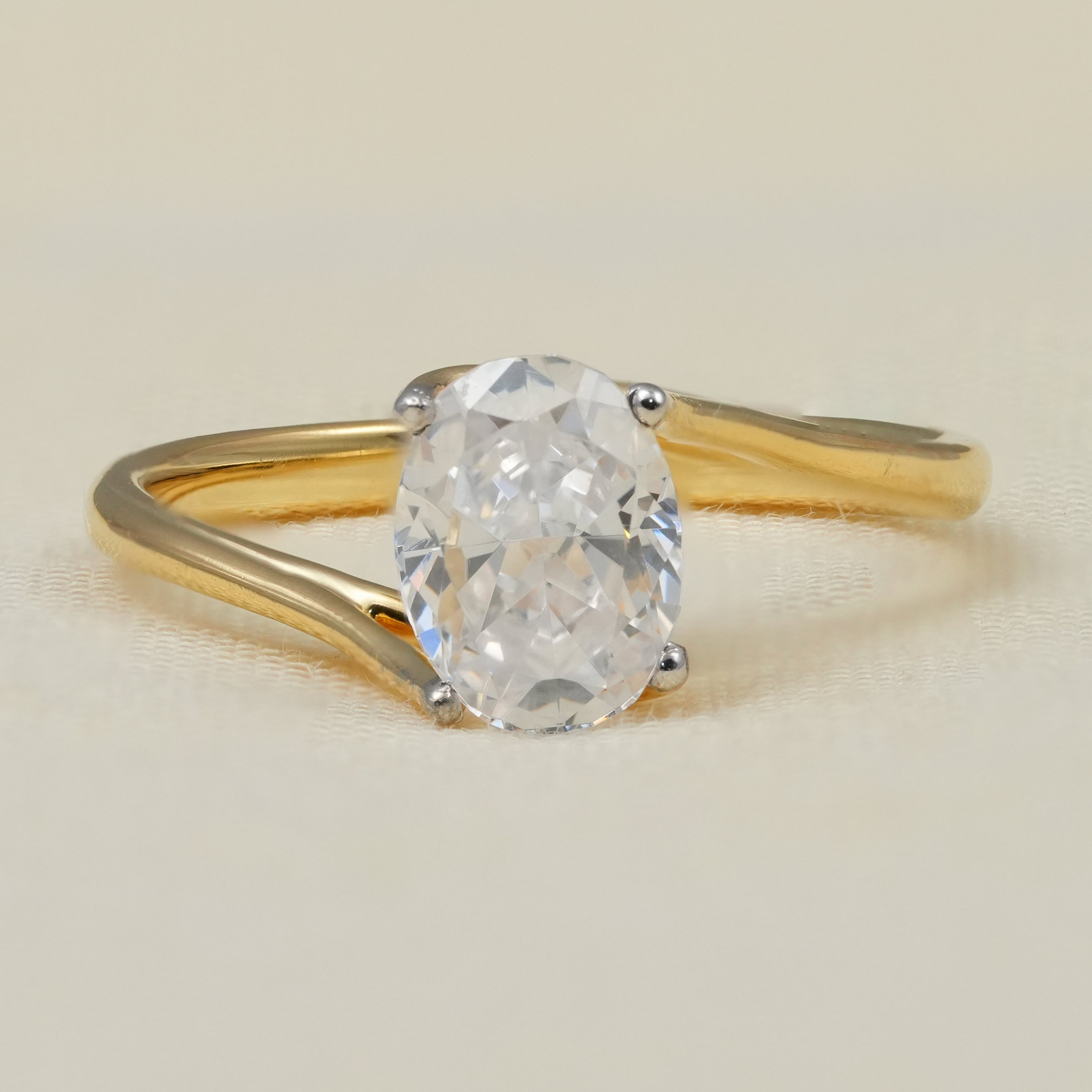 Oval lab grown diamond solitaire engagement ring with modern bypass band
