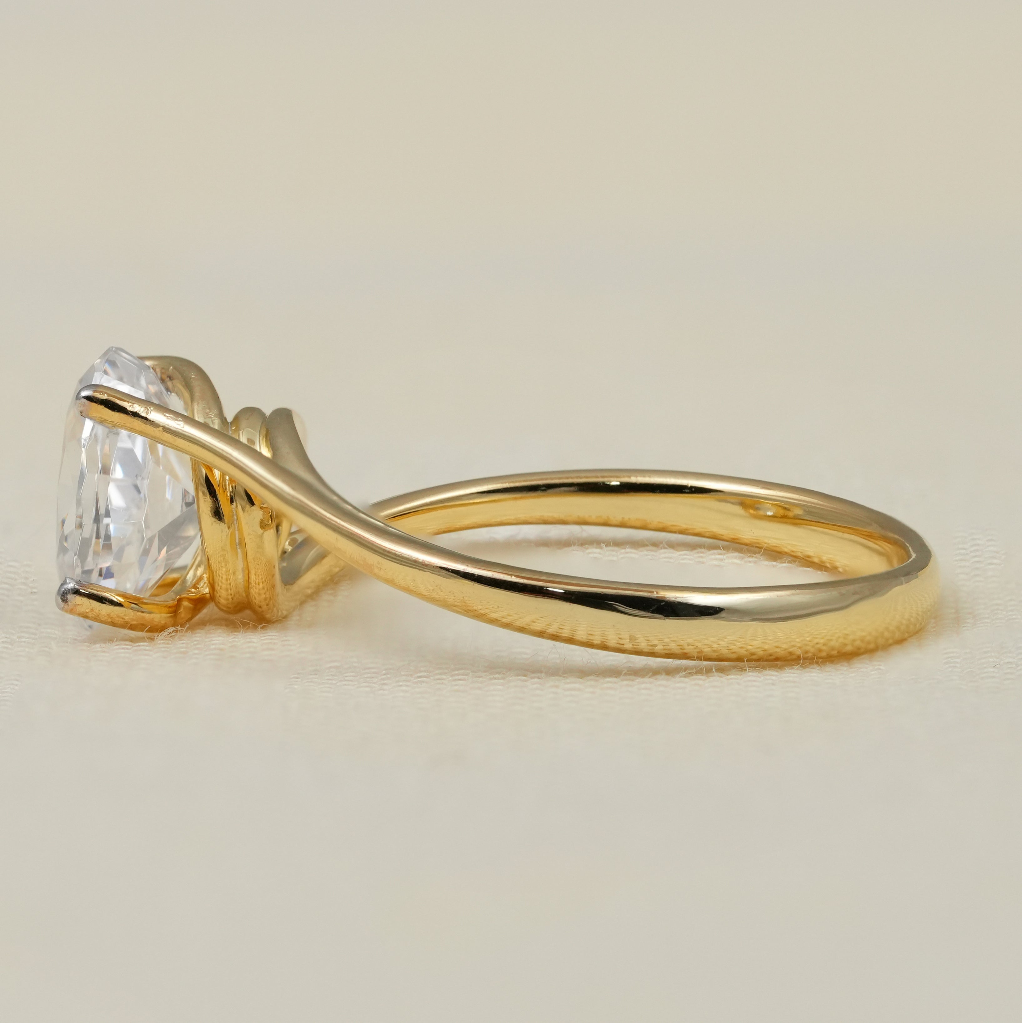 Elegant oval lab grown diamond engagement ring sleek asymmetrical gold setting