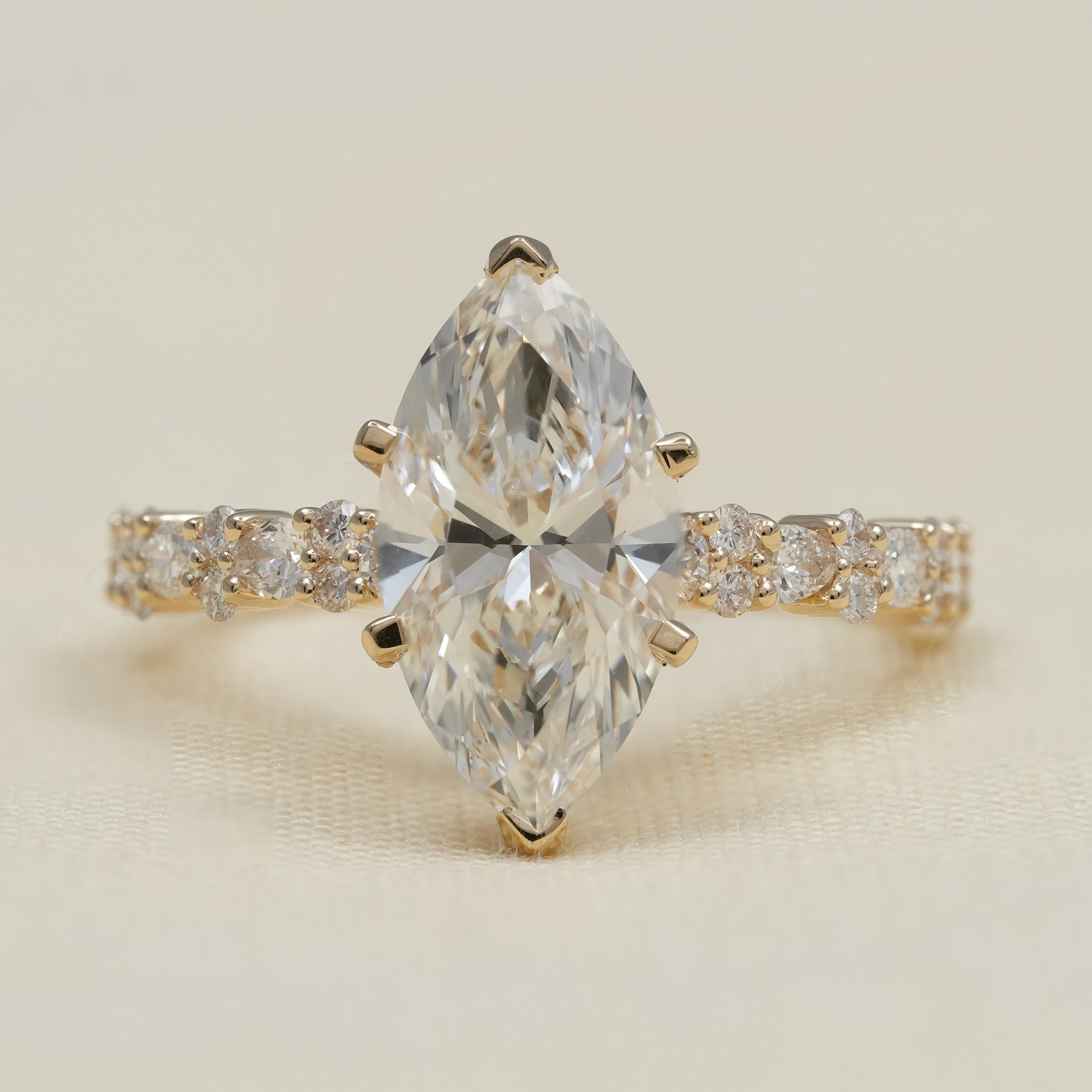 Marquise lab grown diamond engagement ring with yellow gold band