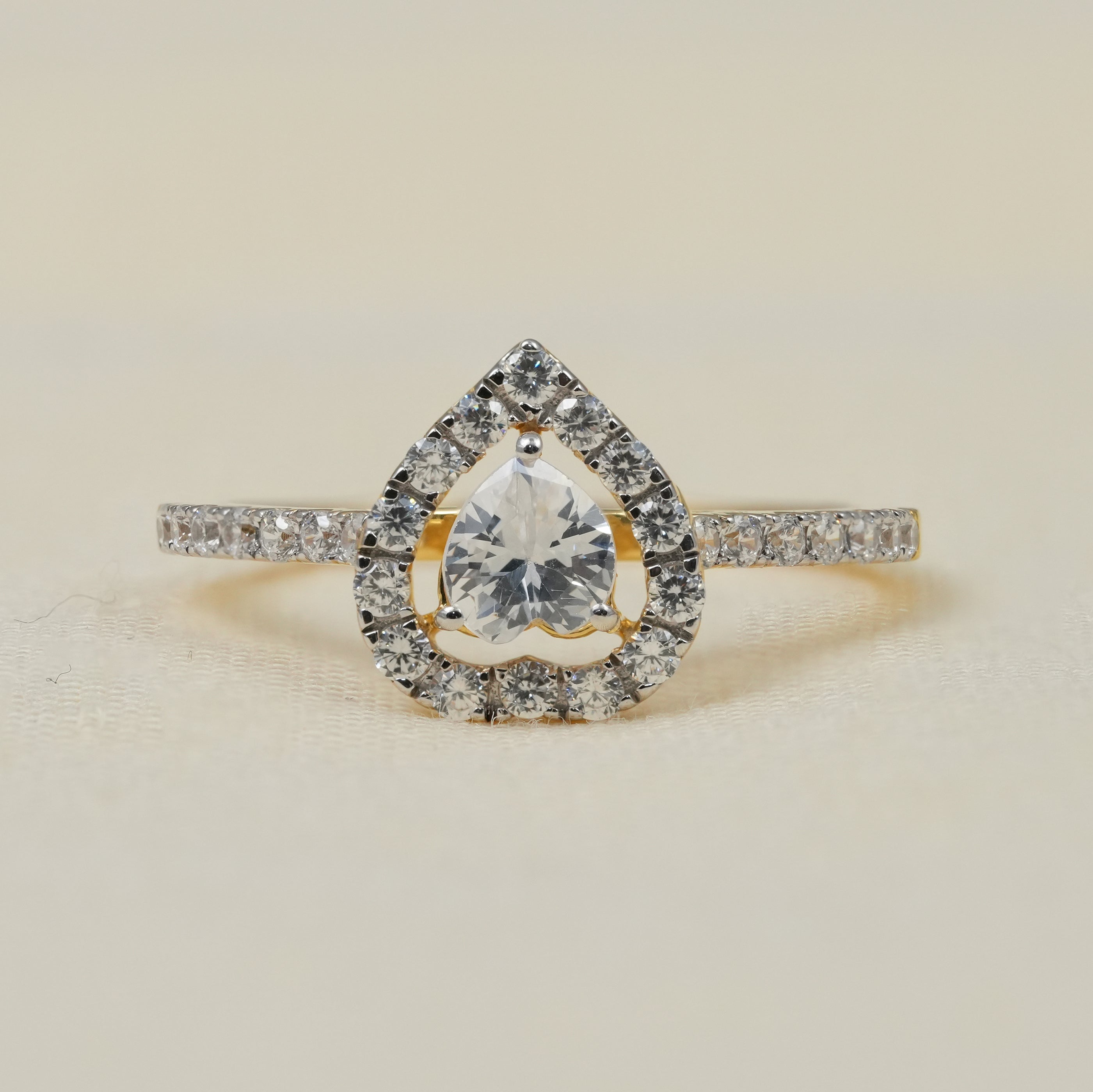 Heart shaped lab grown diamond halo engagement ring with pavé band
