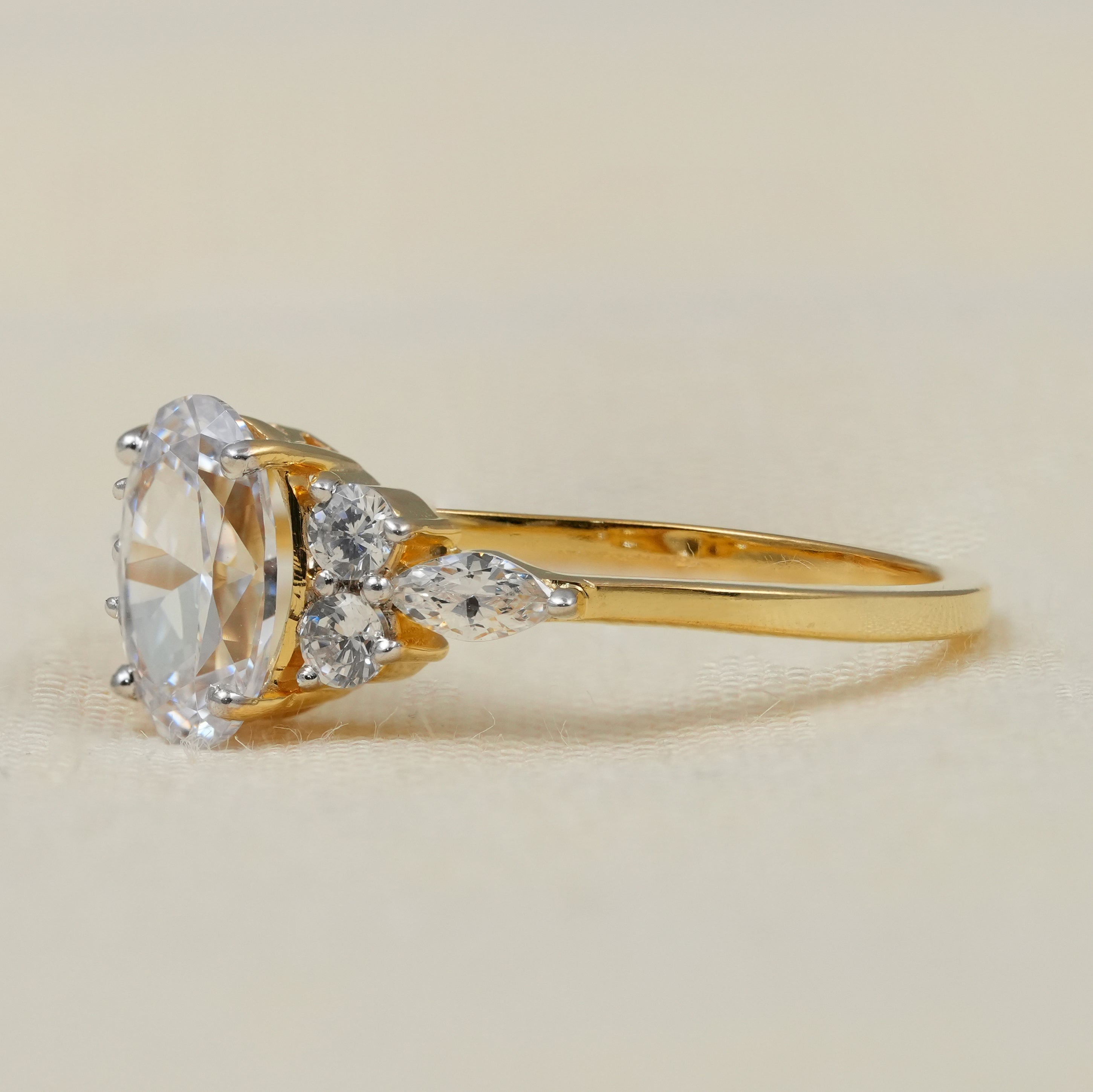 Yellow gold oval lab grown diamond ring with floral cluster accents