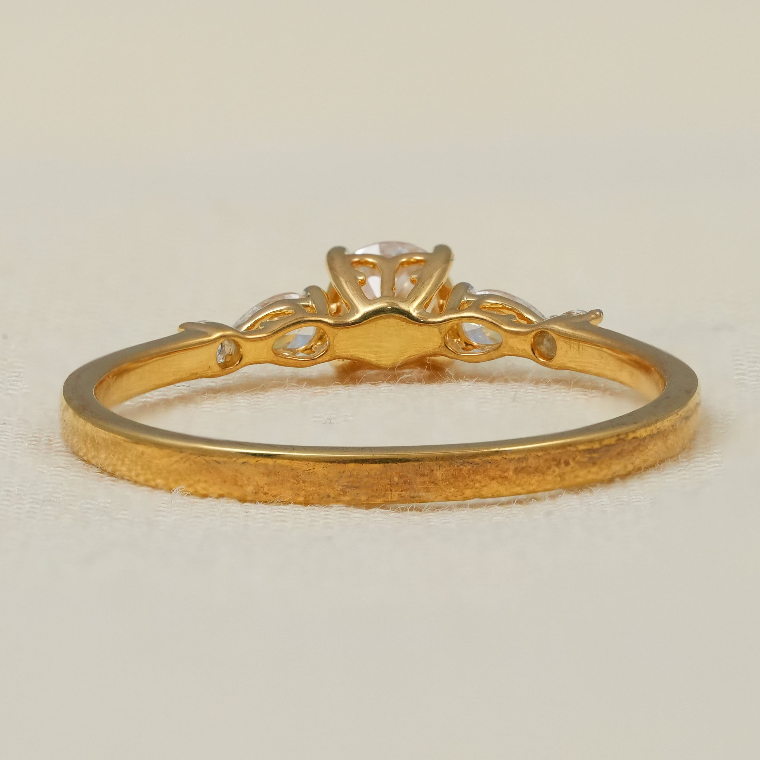 Fine jewelry three stone ring with round lab grown diamond and pear accents