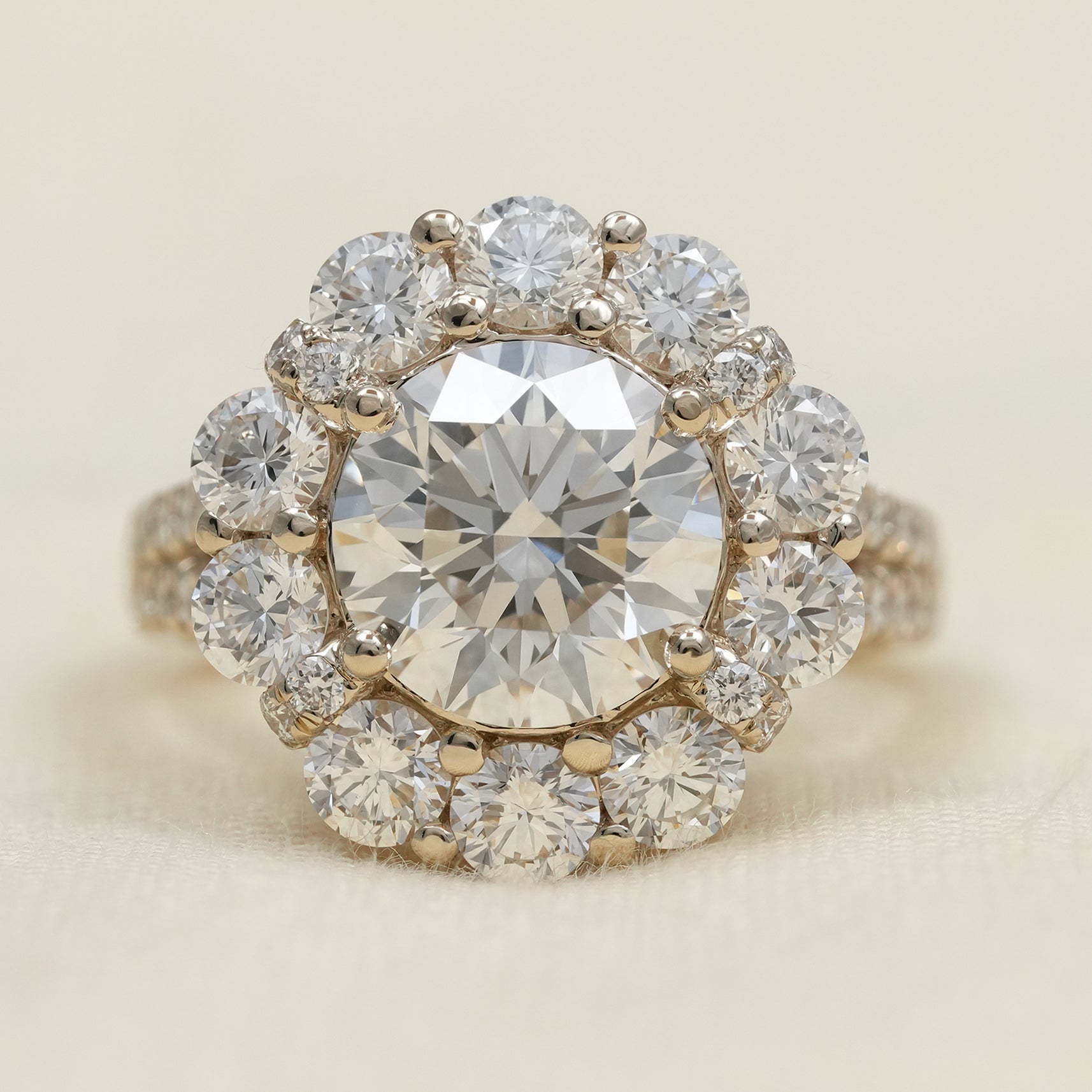 Round lab grown diamond halo engagement ring with floral cluster design