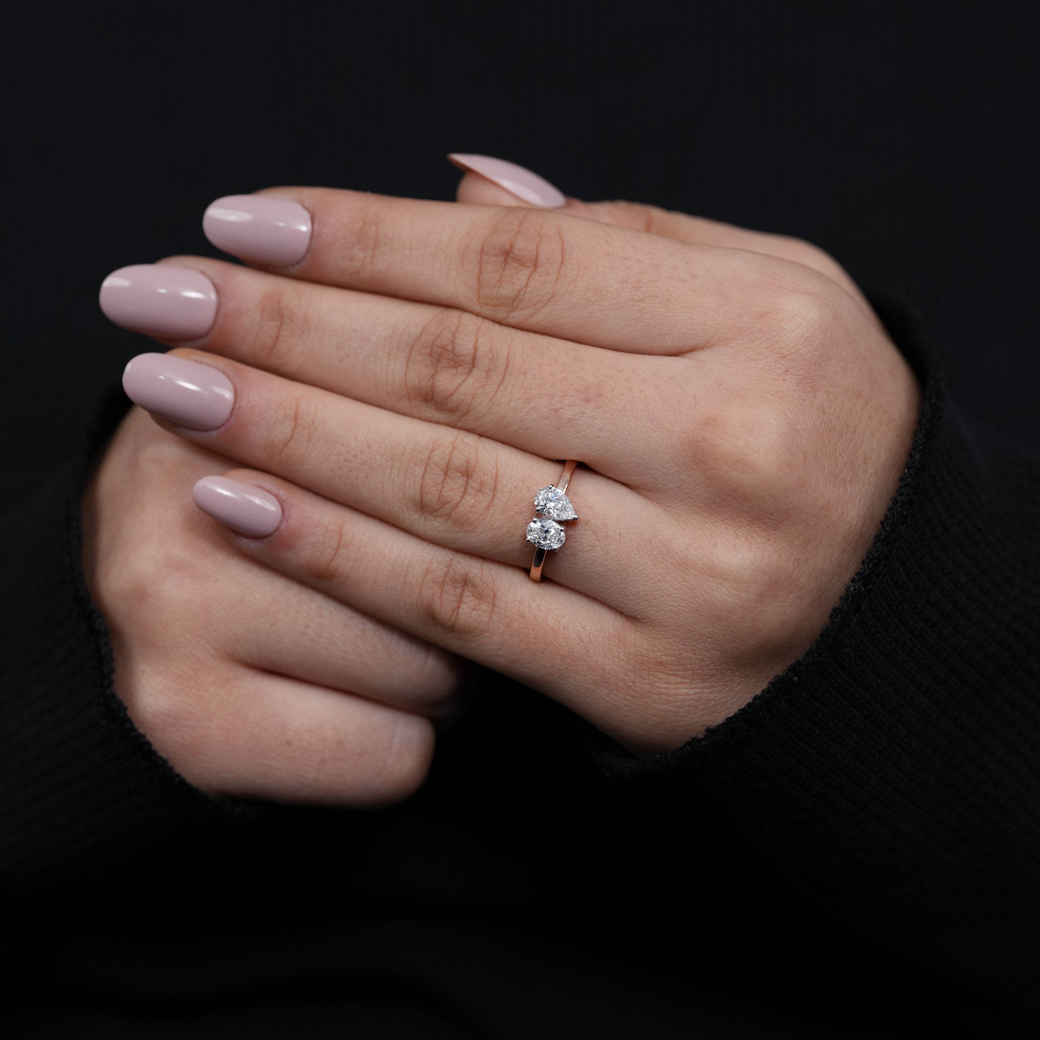 Stylish two stone ring featuring pear oval lab grown diamond stones