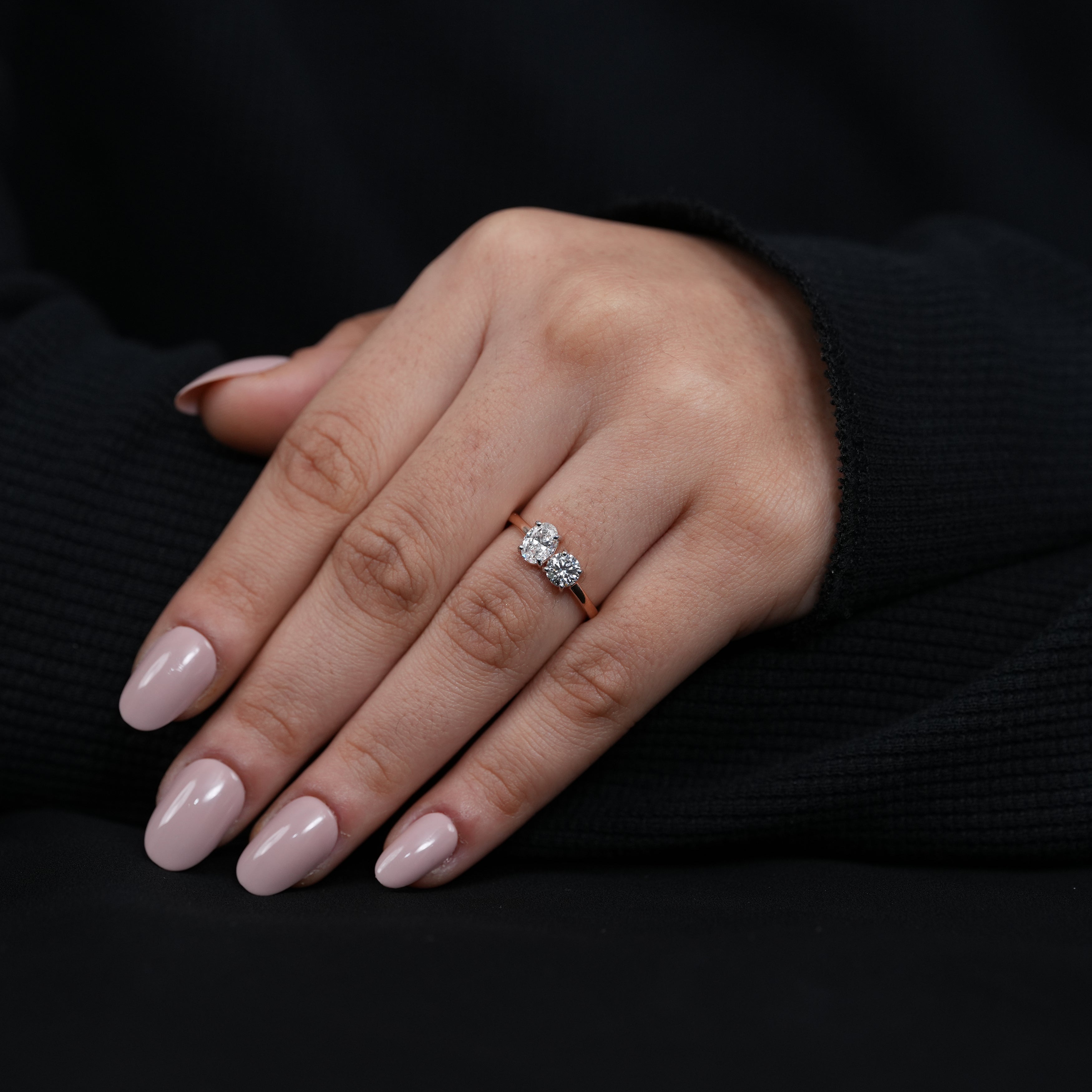 Meaningful two stone ring with oval and round lab grown diamonds