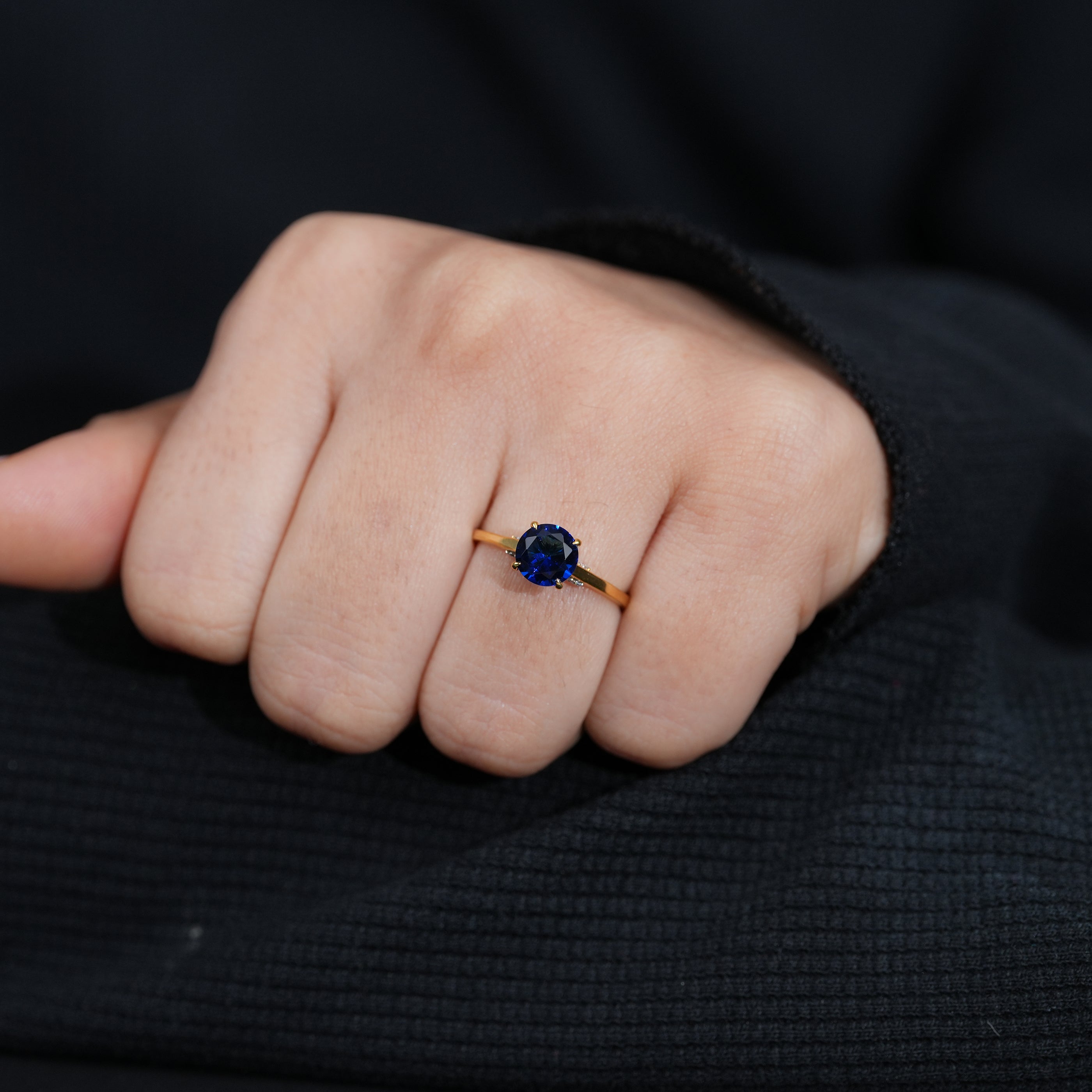 Classic blue sapphire gemstone ring with polished gold band