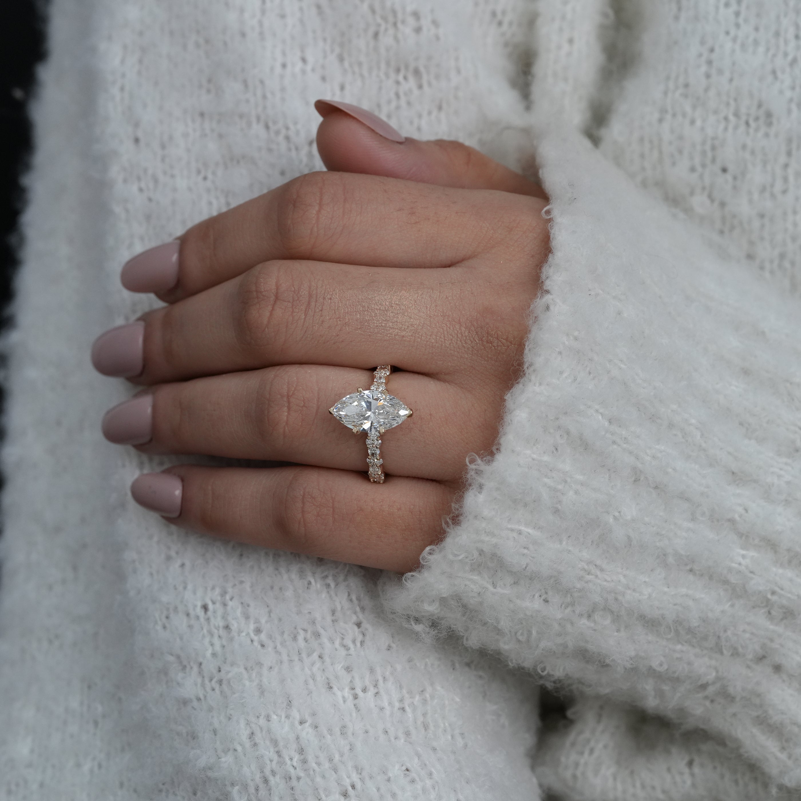 Marquise lab grown diamond engagement ring with side sparkle