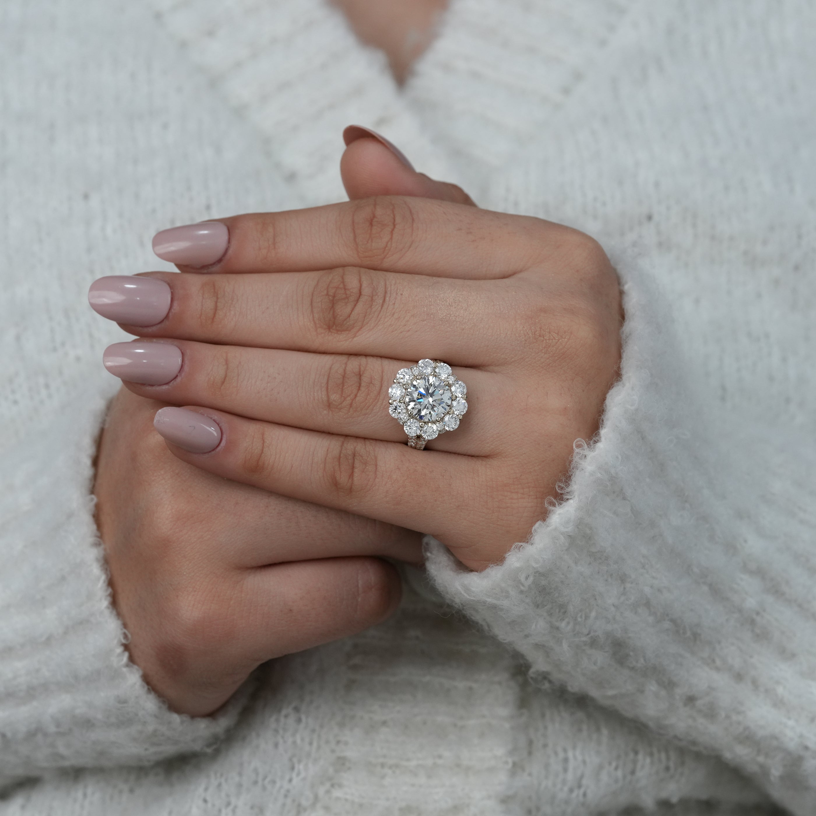 Round lab grown diamond halo ring with brilliant accent diamonds