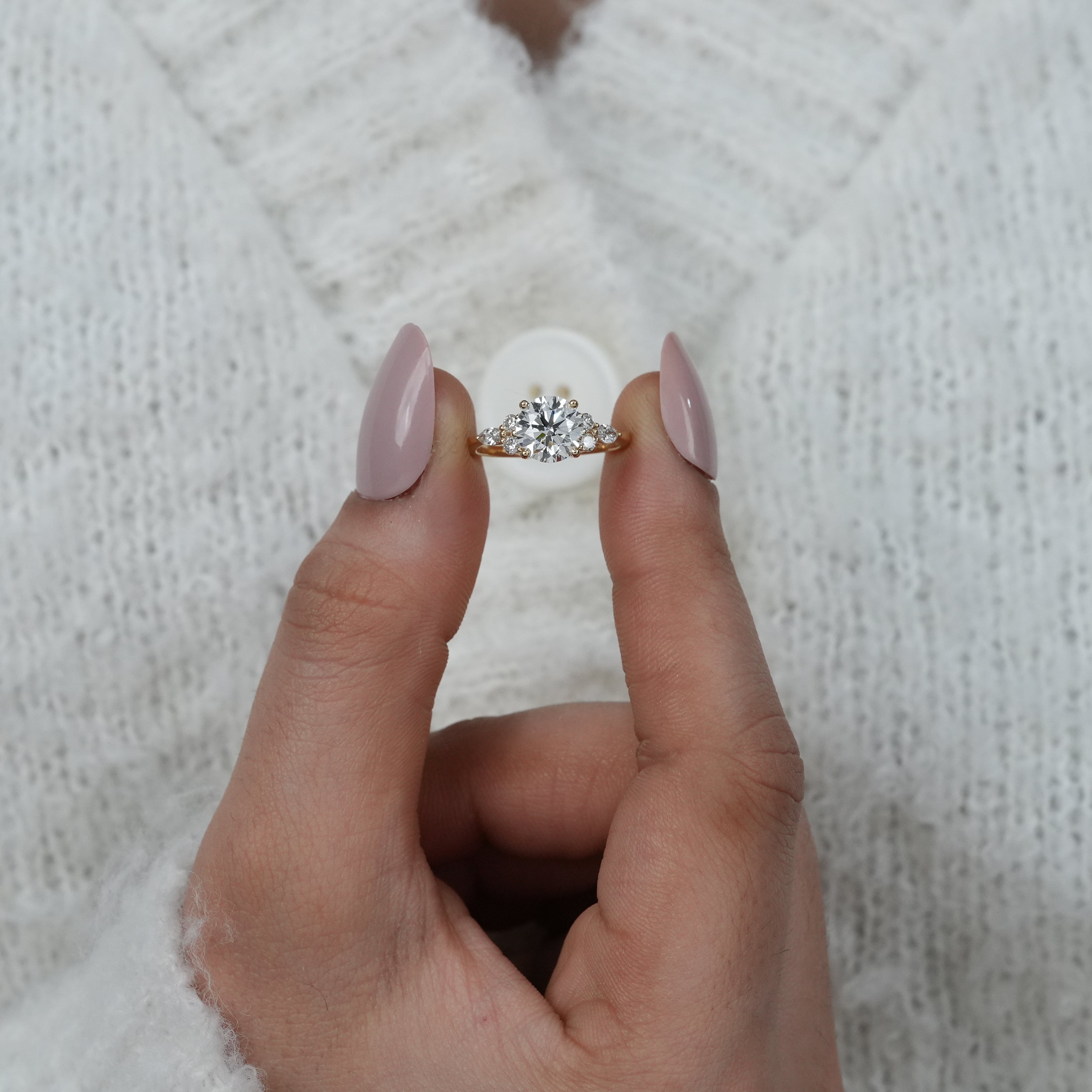 Vintage inspired round lab grown diamond ring with cluster sides