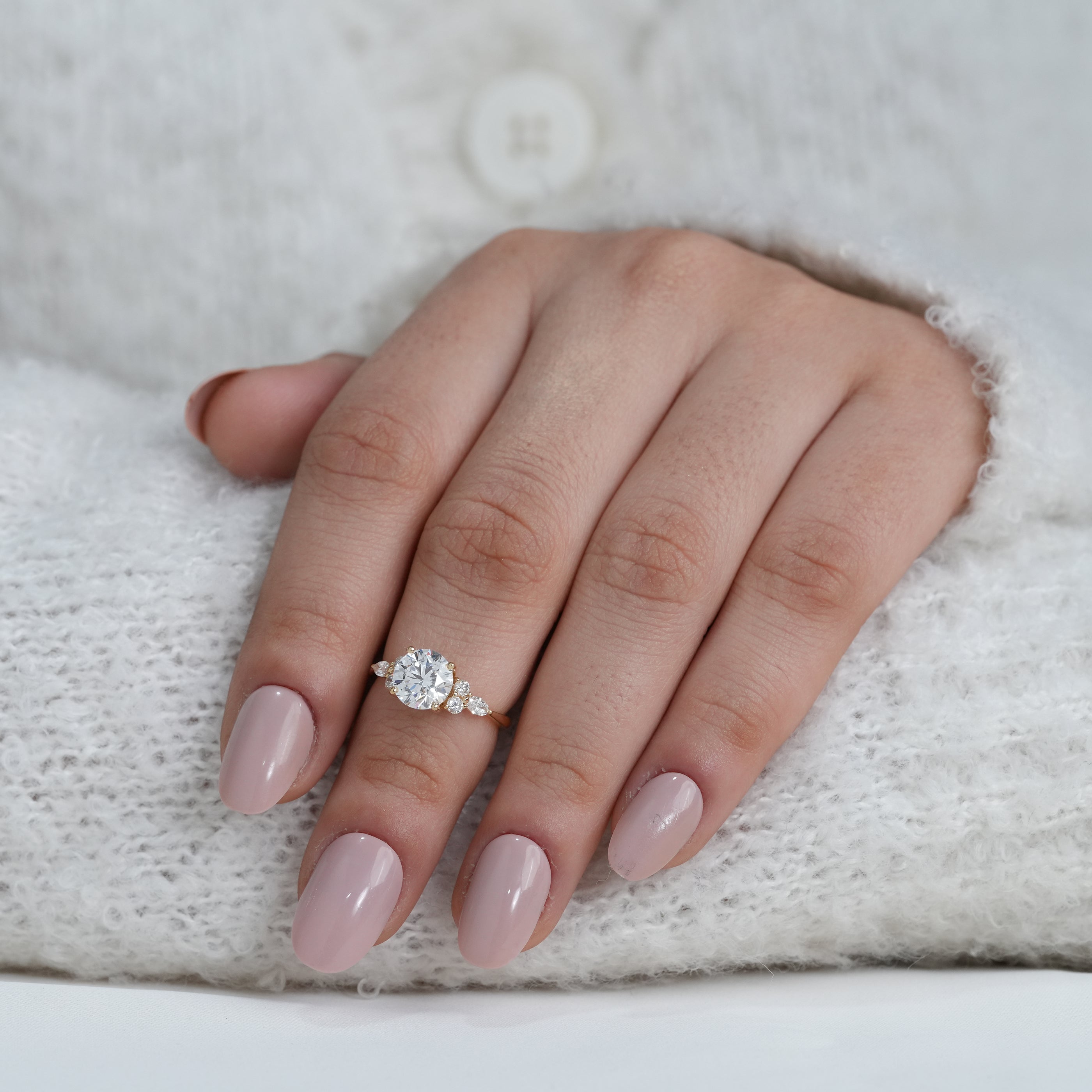 Round lab grown diamond ring with delicate floral inspired shoulders
