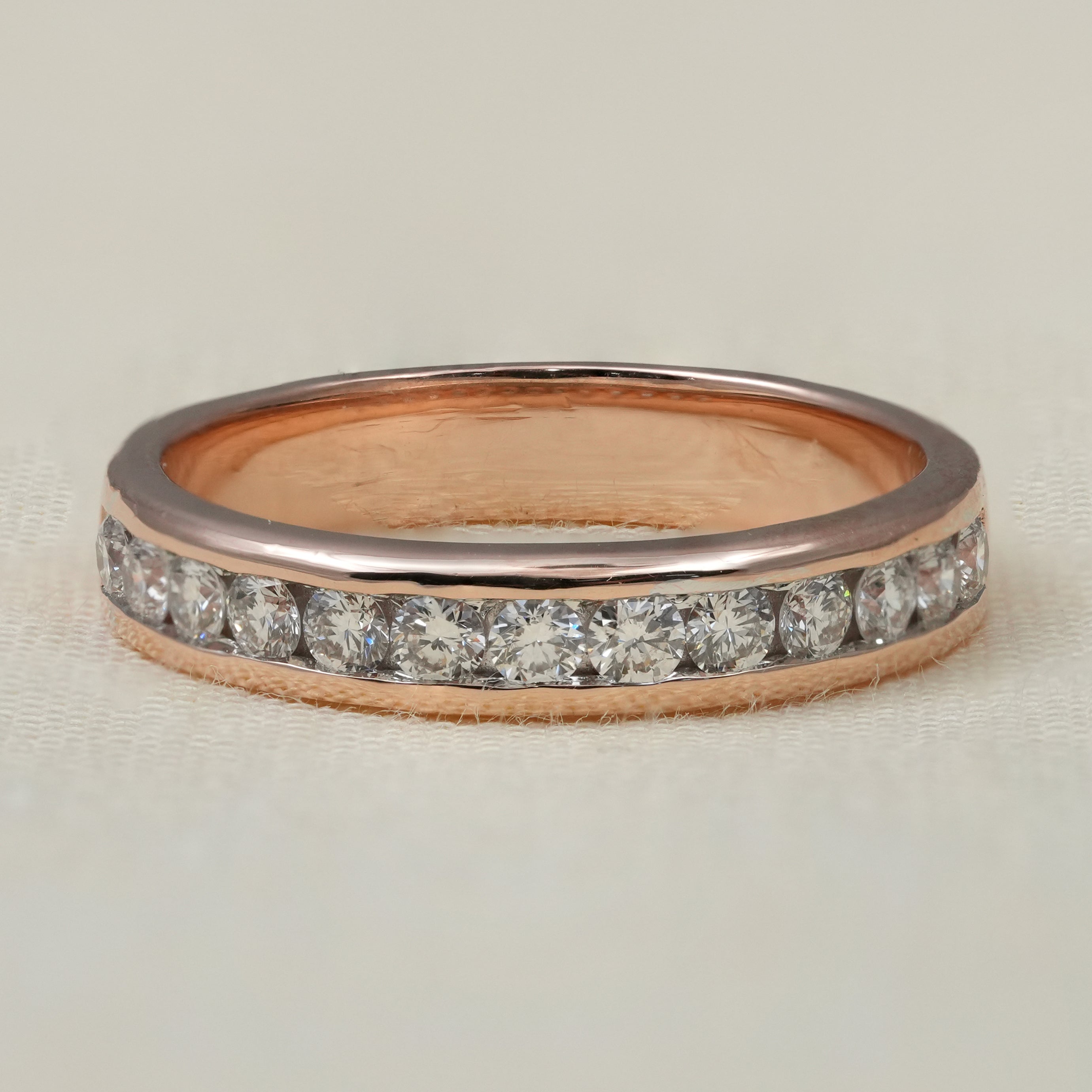 Rose gold channel set lab grown diamond wedding band minimalist design