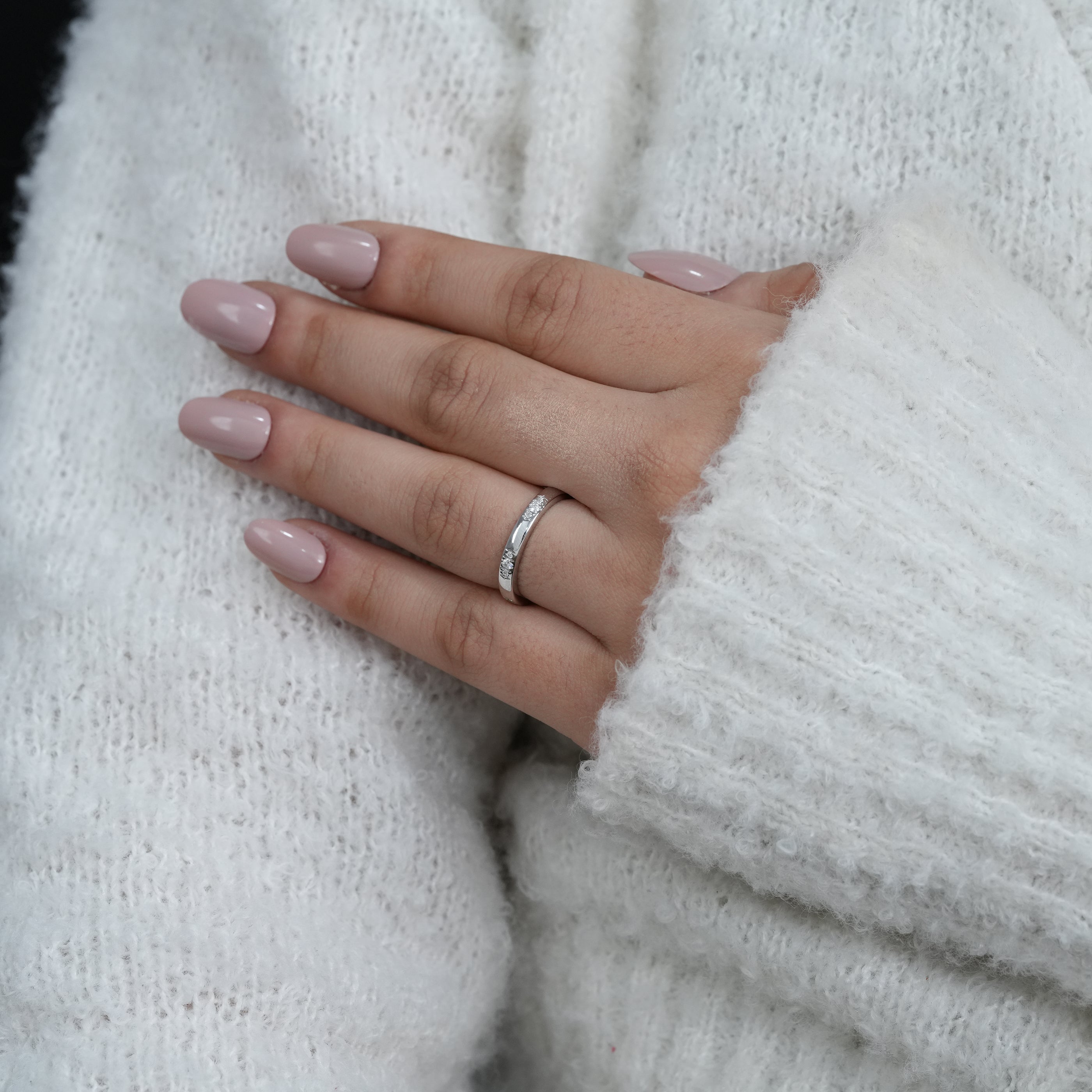 Slim white gold ring with minimalist diamond accents
