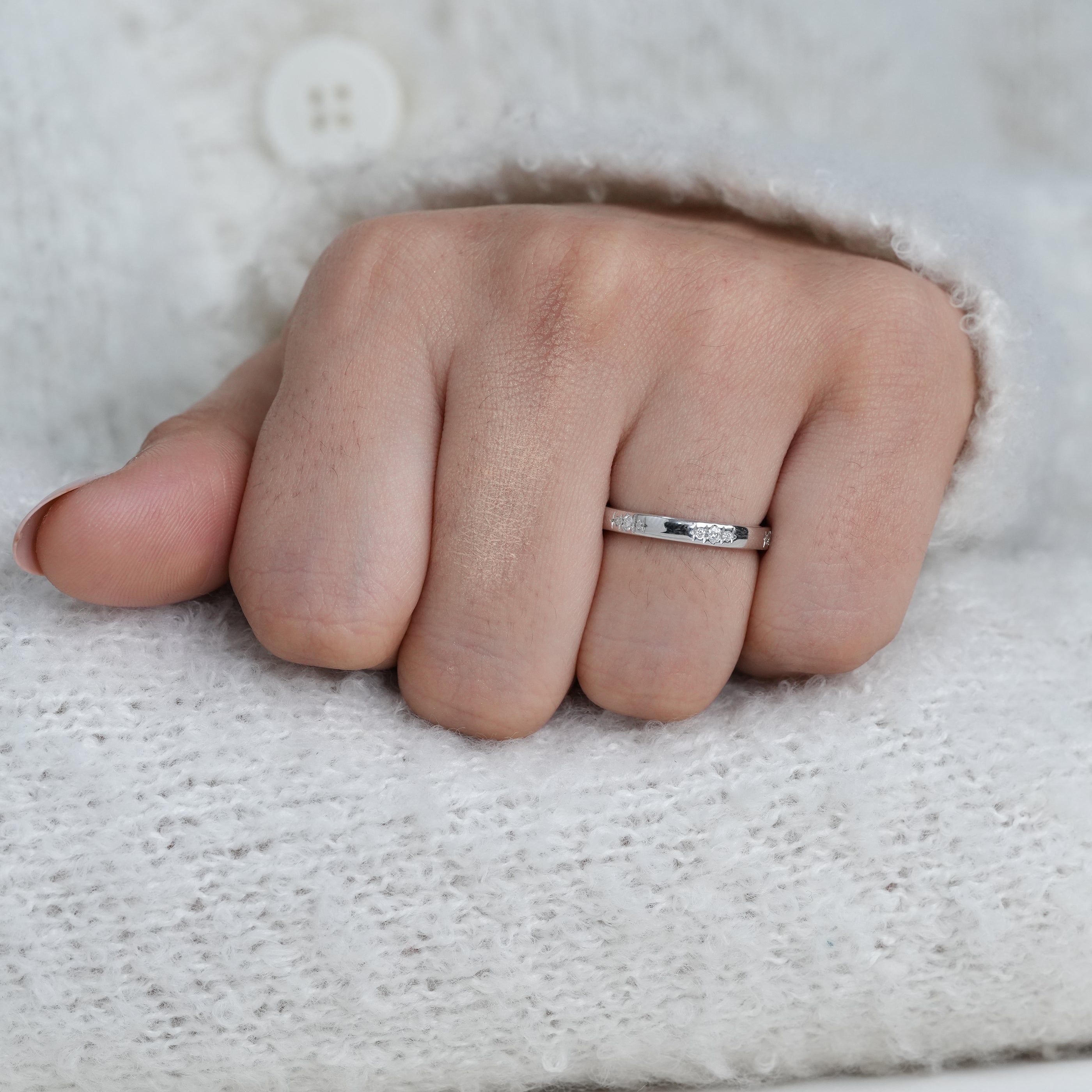 Clean design white gold band with inset diamonds