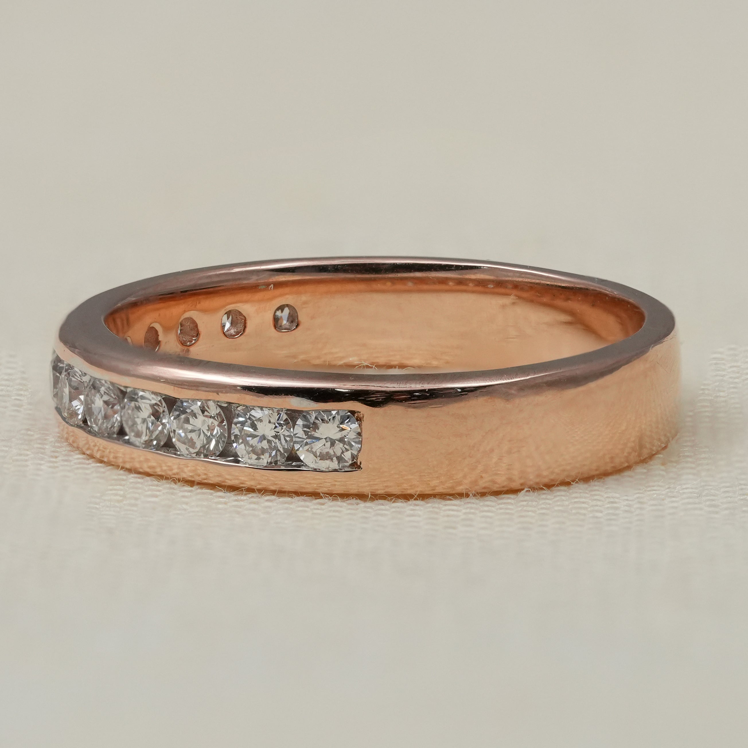 Slim rose gold band with channel set lab grown round diamonds