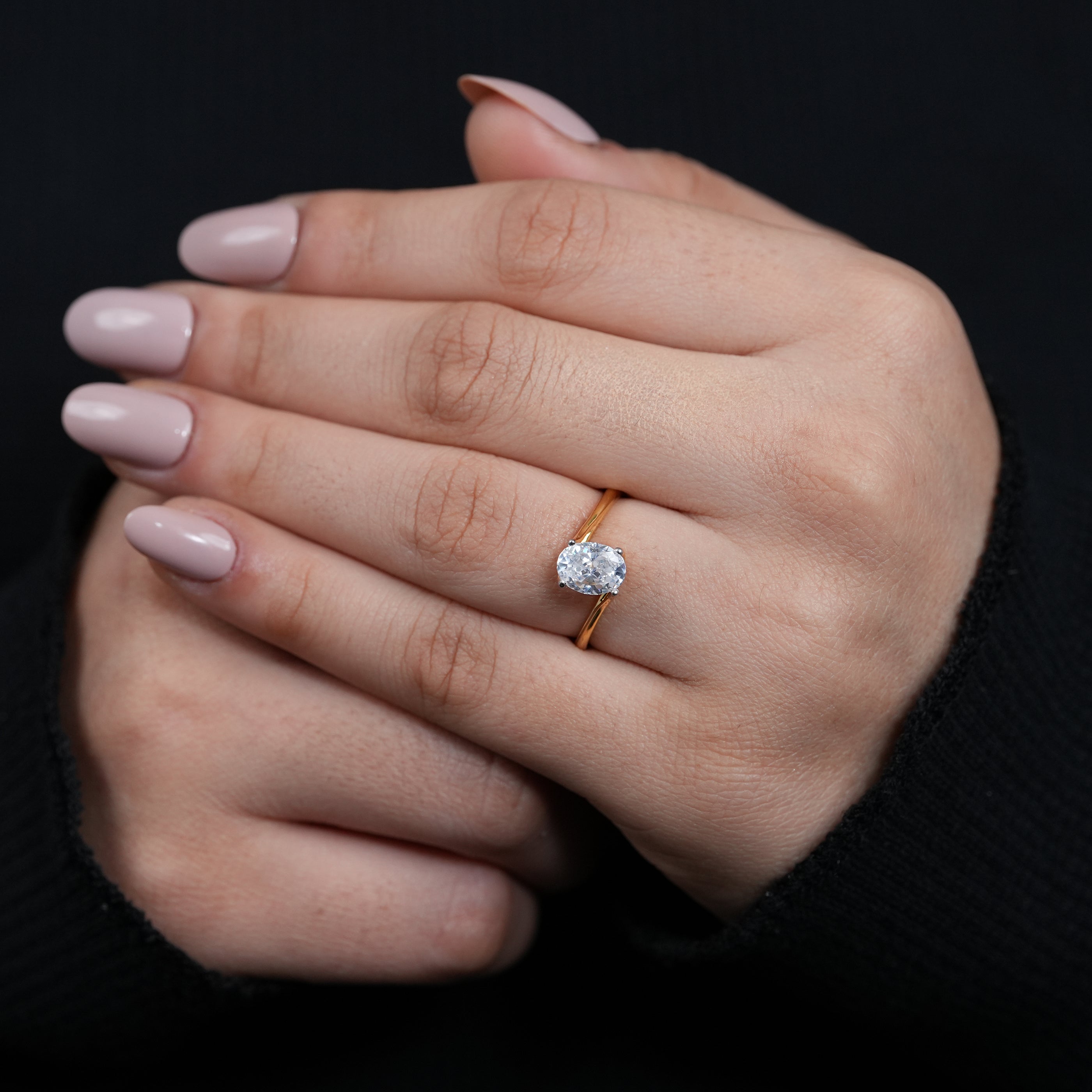 Timeless oval lab grown diamond ring modern sculpted bypass setting