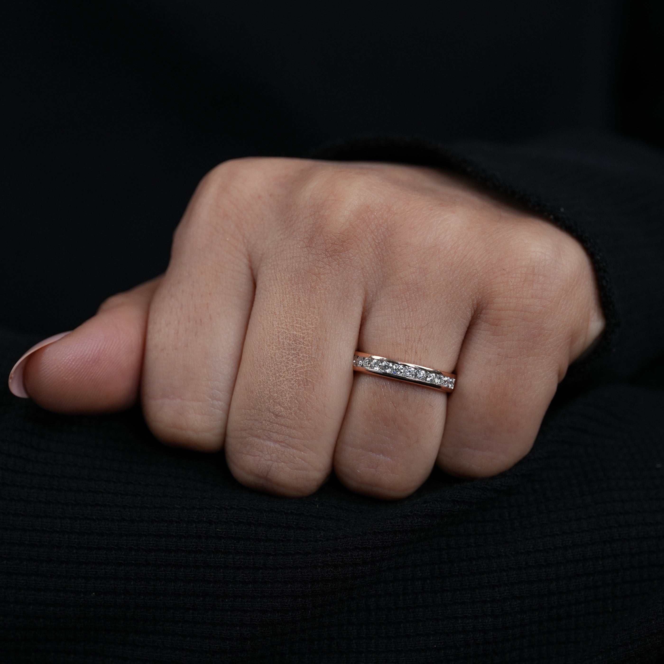 Minimalist rose gold band featuring channel set lab grown diamonds