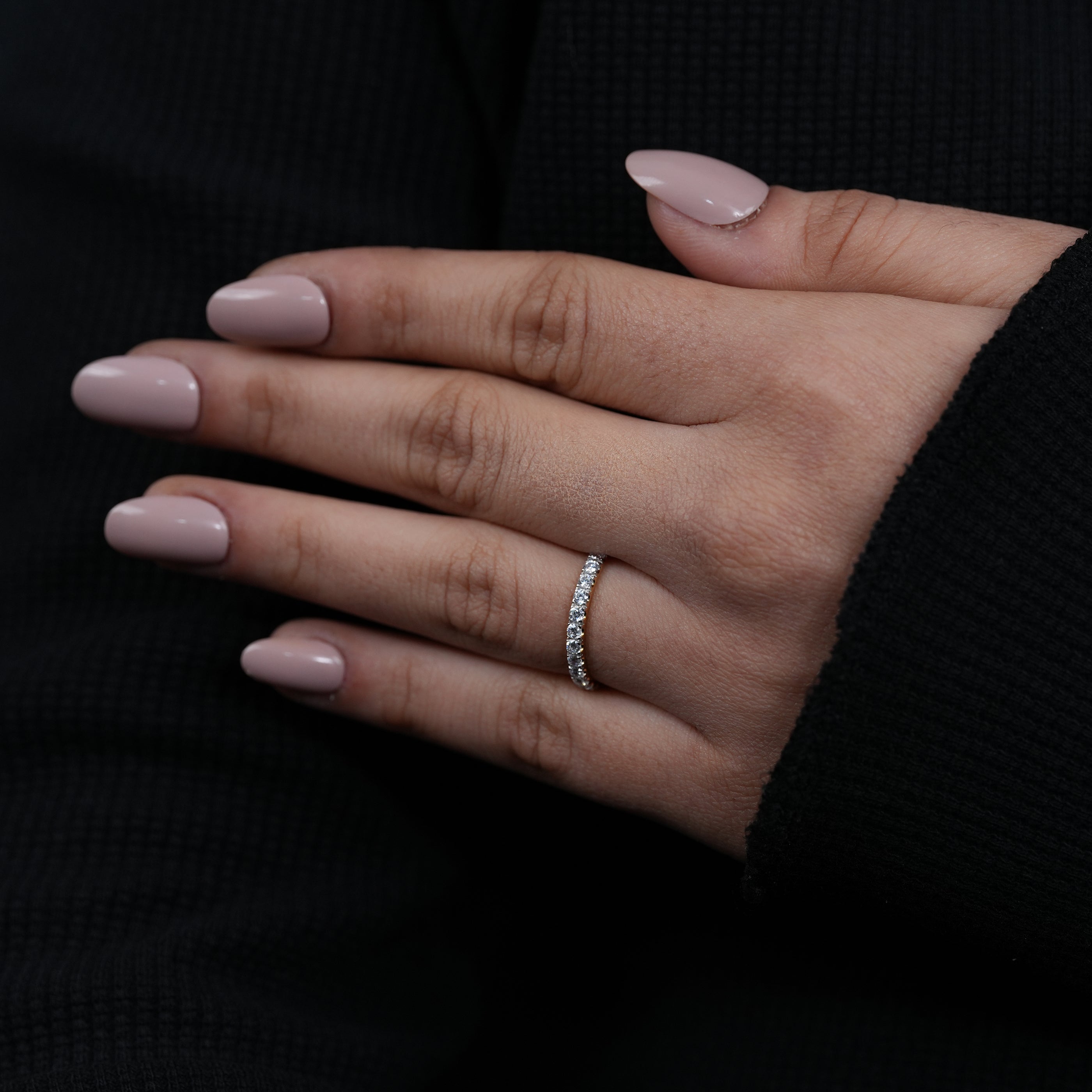 Minimalist wedding band featuring prong set lab grown diamonds