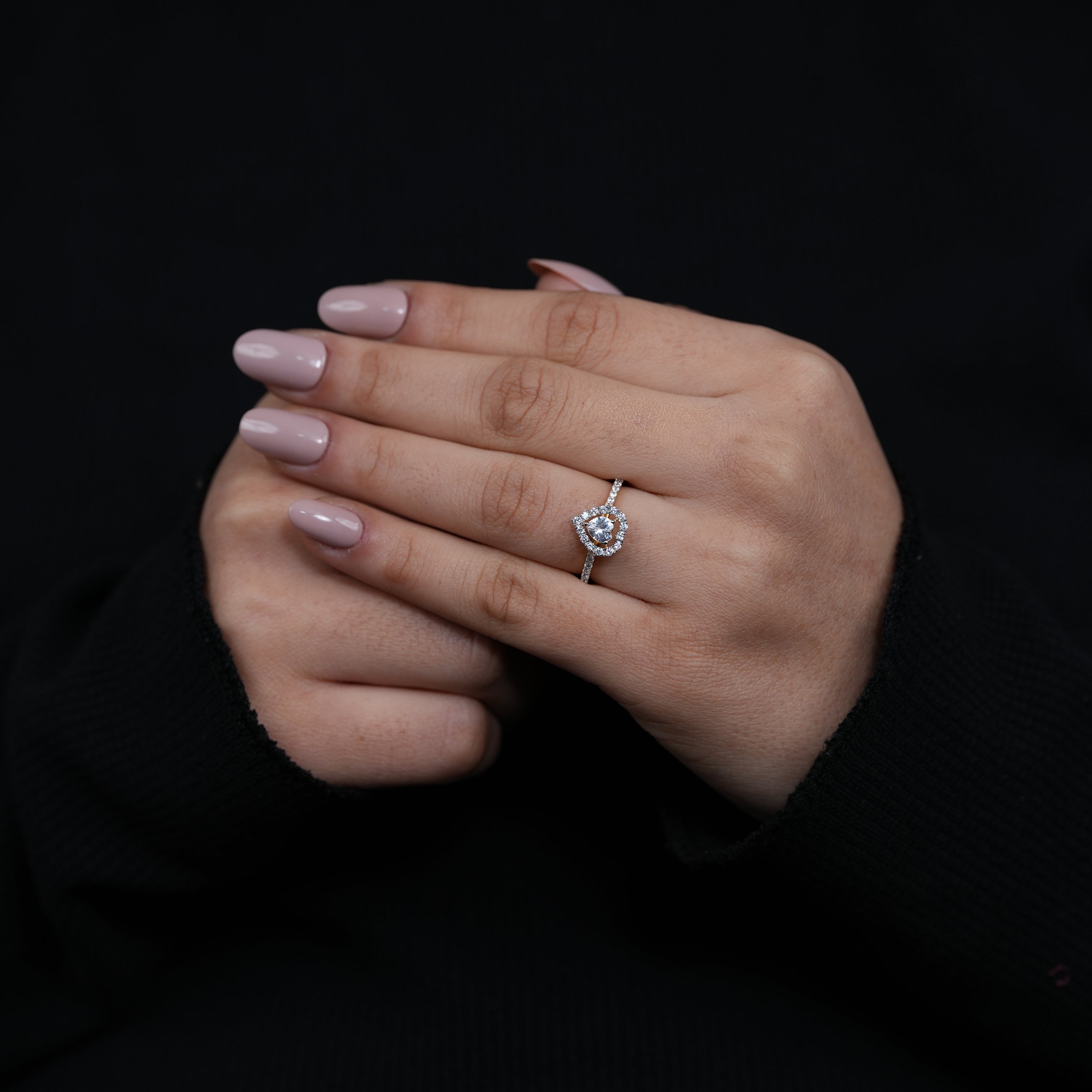 Dainty heart lab grown diamond engagement ring framed by radiant halo