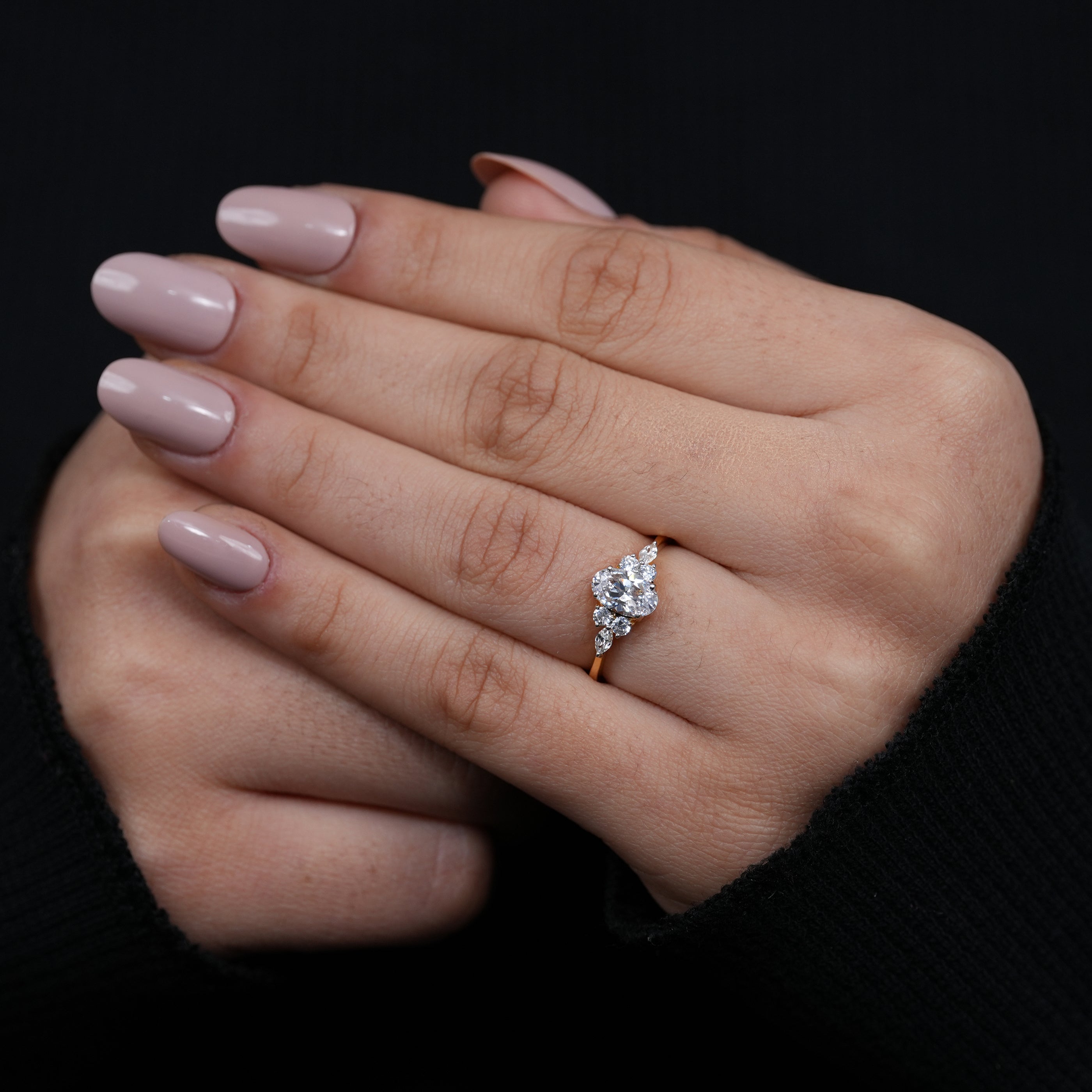 Minimal yellow gold oval lab grown diamond ring with shimmering cluster sides