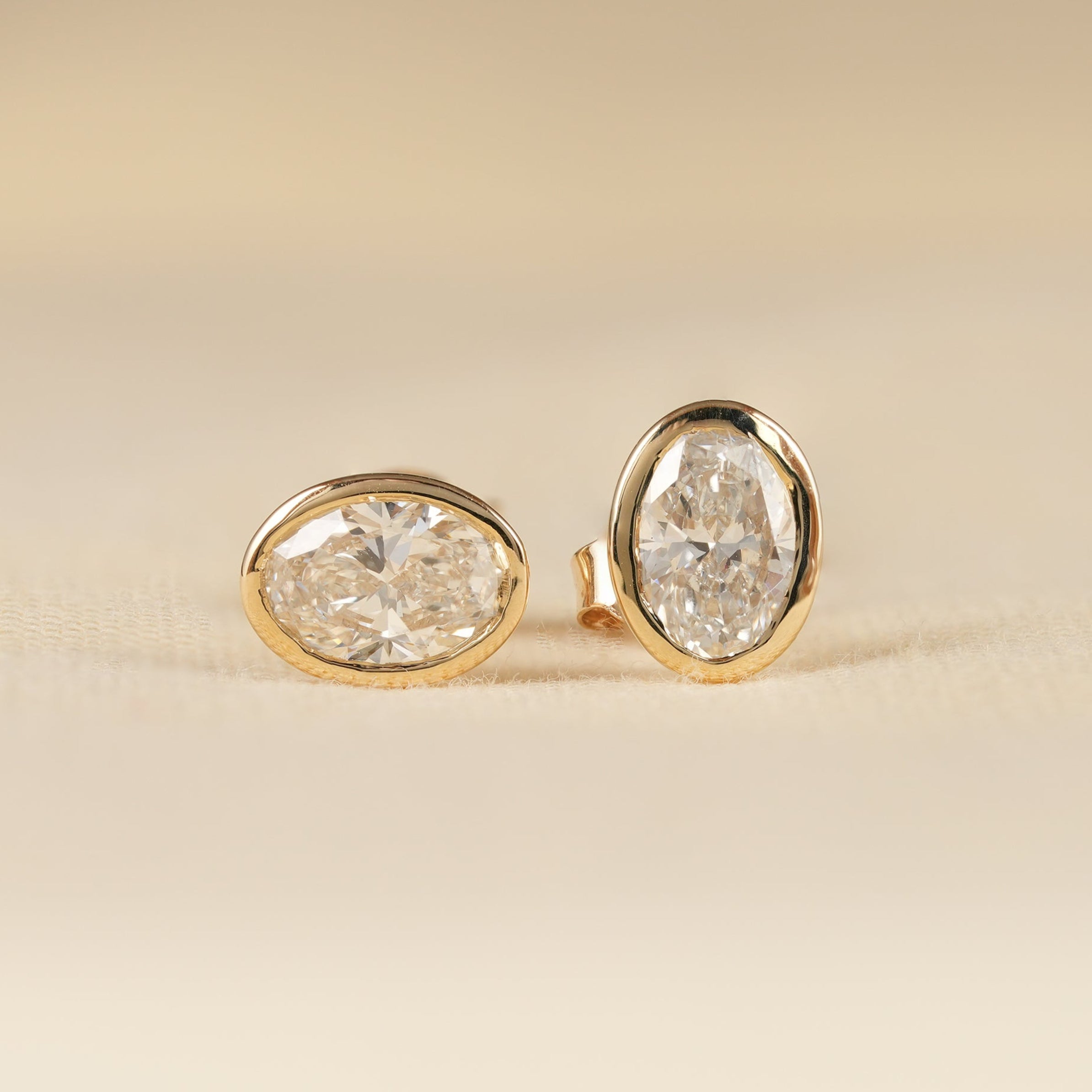 Bezel Set Oval Lab Diamond Solitaire Stud Earrings in Yellow Gold