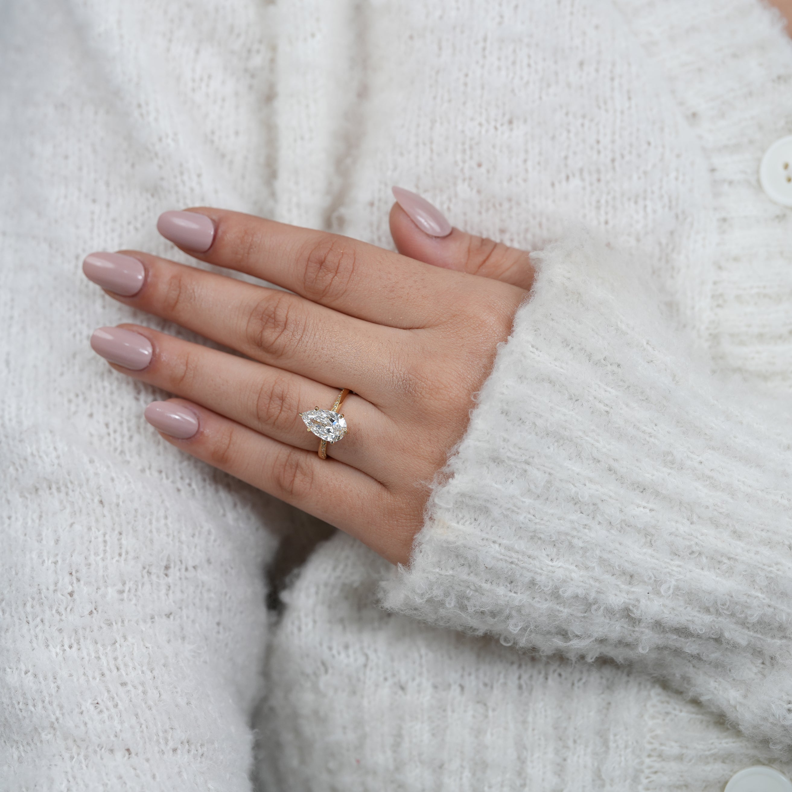 Classic pear lab grown diamond ring with slim yellow gold pavé band