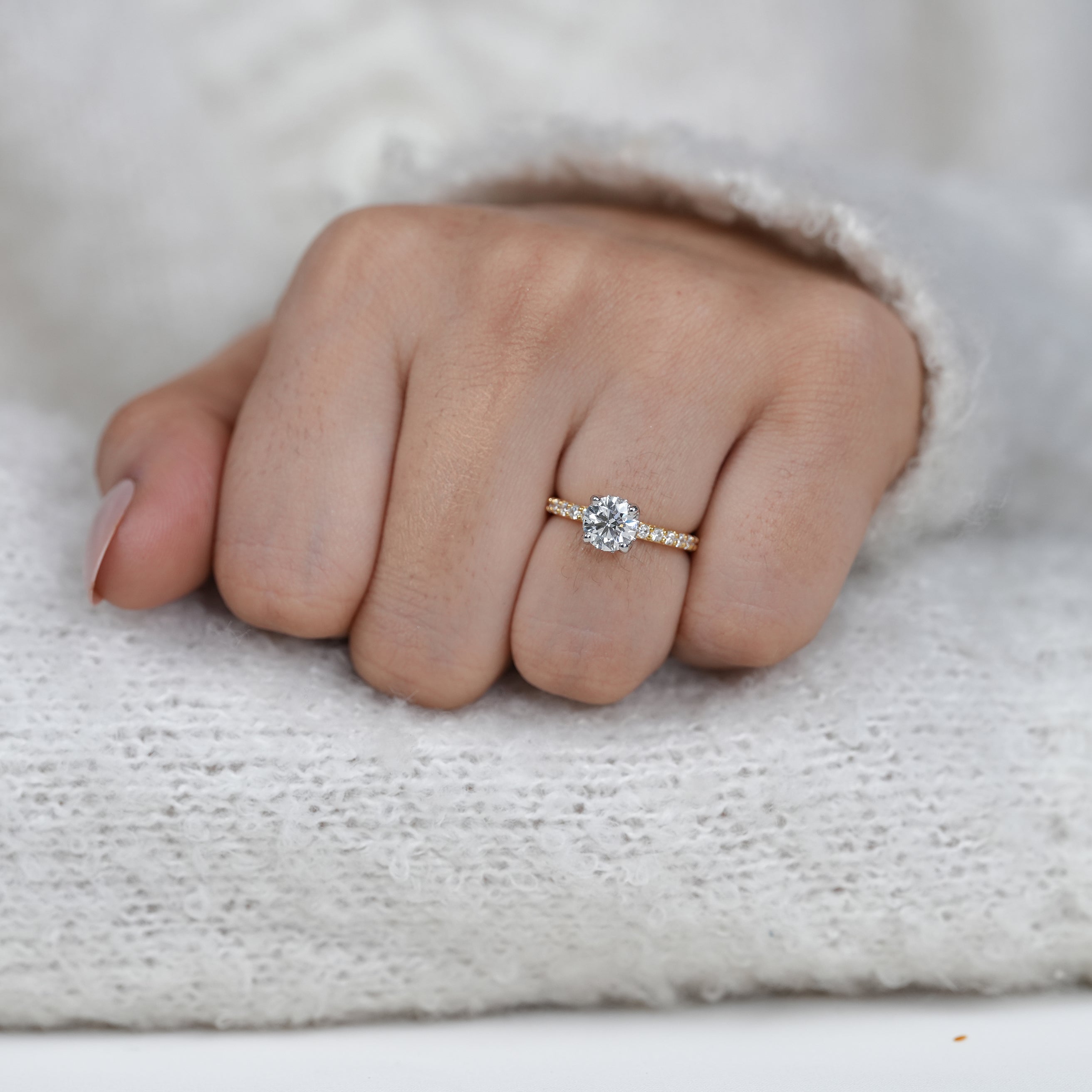 Fine round lab grown diamond solitaire in yellow gold setting