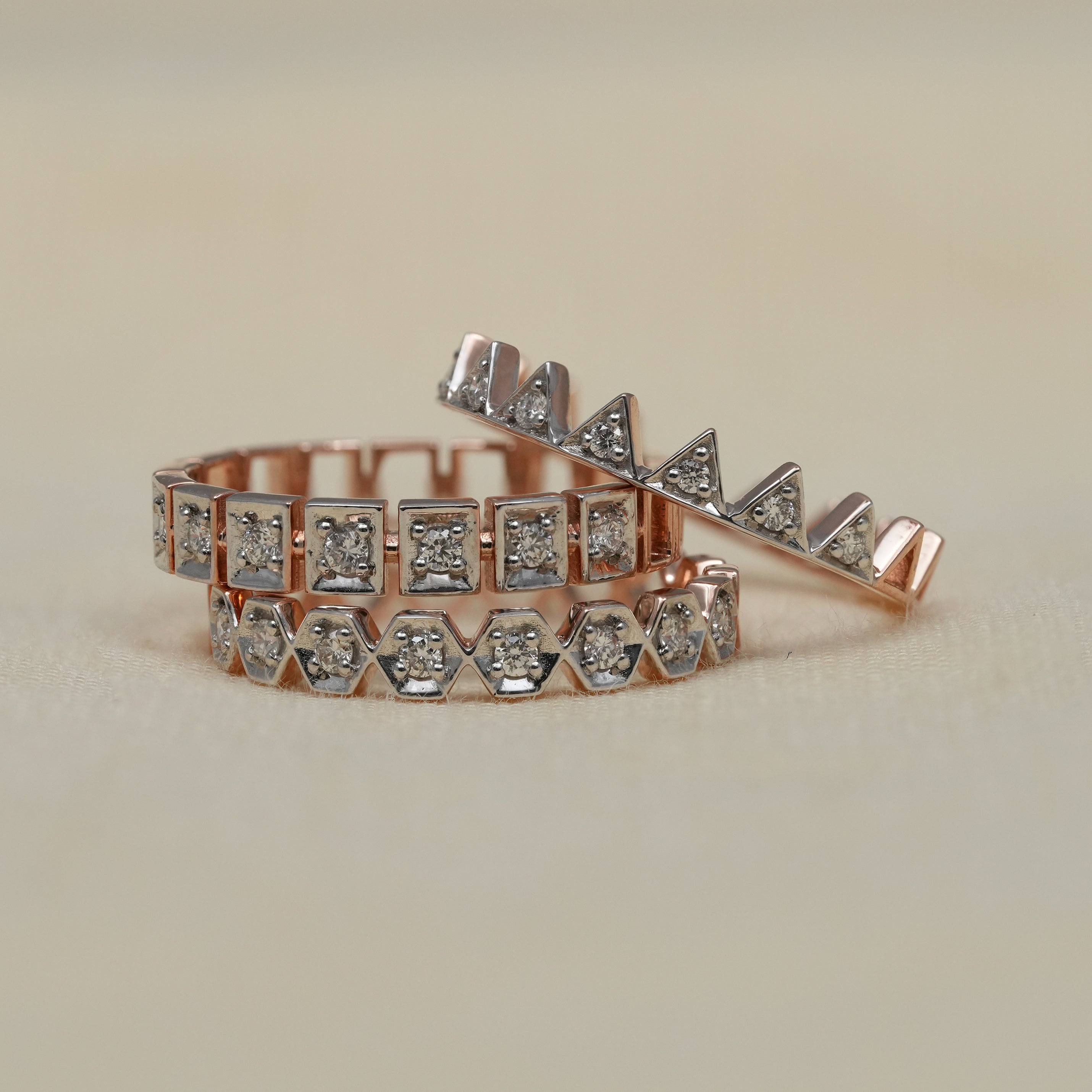 Modern crown inspired diamond band stack in rose gold and white gold
